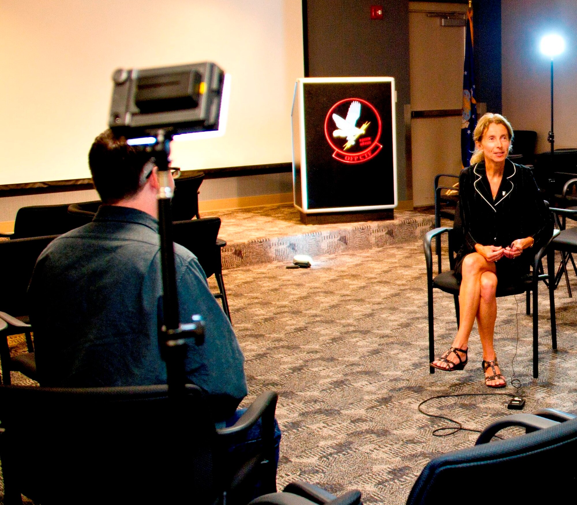 Dr. Betta Jerome, the technical advisor for the AF Test Center, Armament and Weapons Test and Evaluation, explains to Dr. Adam Santone, CPALMs' science specialist,how a sled track works for a video on forces, motion, and energy conversion. The video will link to a Florida state standard for use by teachers.   (USAF photo/Master Sgt. Justin Sudderth)

