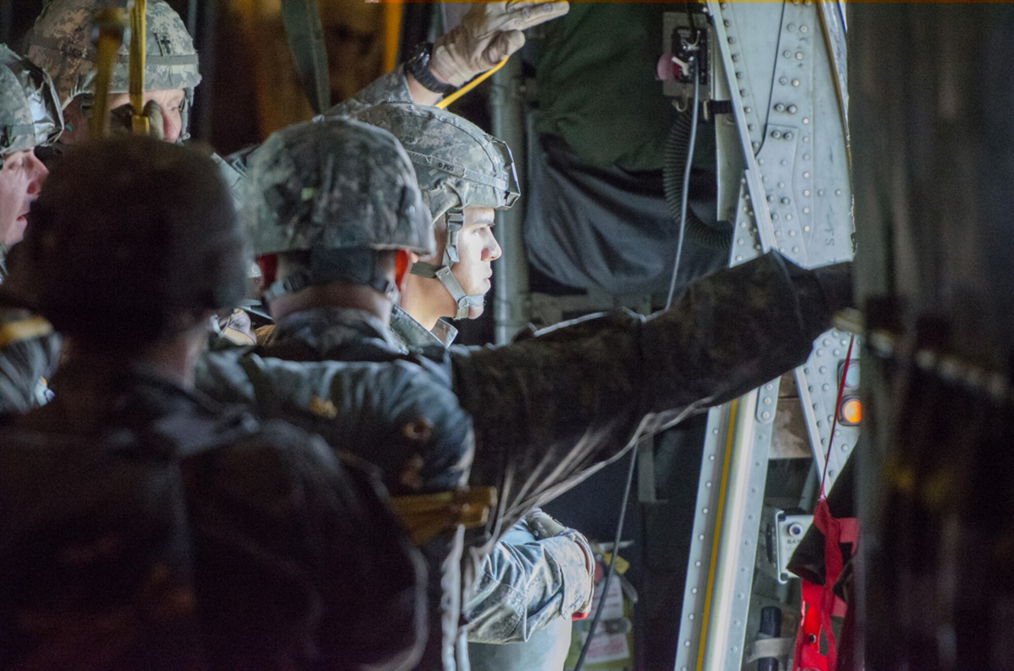 Soliders from the 2-377th Parachute Field Artillery Regiment, 4th IBCT 25 Infantry Division get ready to perform a static line jump out of a Kentucky Air National Guard C-130 Hercules just north of Joint Base Elmendorf-Richardson, Alaska, on May 13, 2014. 165th Airlift Squadron aircrews are receiving a lot of great training while participating in Red Flag-Alaska. (U.S. Air National Guard photo by Master Sgt. Phil Speck)
