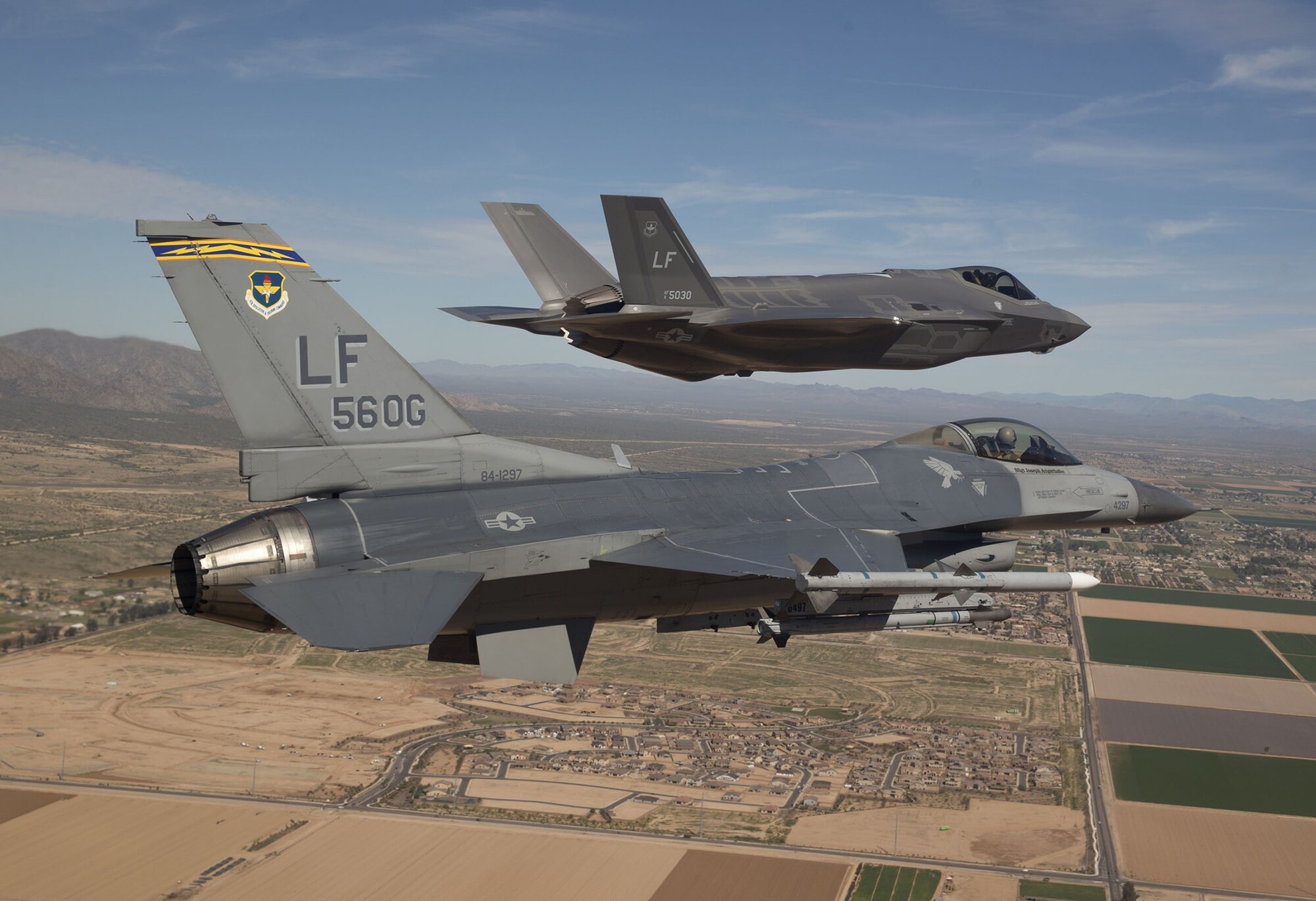 Robinson pilots an F-16 as it escorts the first F-35 to Luke Air Force Base, Arizona, in March. (Jim Hazeltine)
