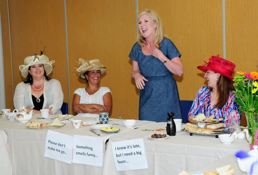 Shannon Bibb, wife of U.S. Air Force Col. Kenneth T. Bibb Jr., 100th Air Refueling Wing commander, speaks to other military spouses at the Military Spouse Appreciation Day High Tea May 20, 2014, at the chapel on RAF Mildenhall, England. Mrs. Bibb shared her experiences of when she first became a military spouse and how the spouse family network has helped her and her family over the years. She stressed the importance of spouses and how working together to help each other builds a stronger community. (U.S. Air Force photo by Karen Abeyasekere/Released)