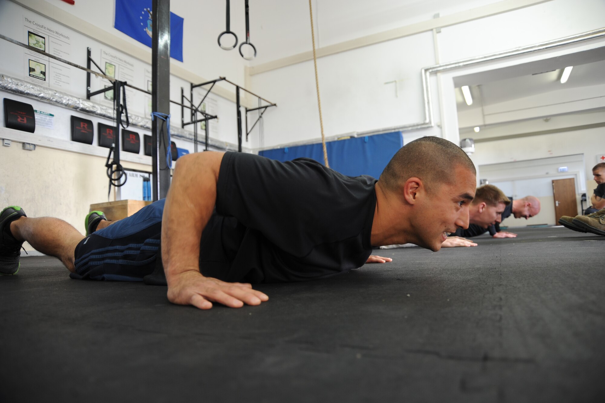 U.S. Air Force Tech. Sgt. James Yerger, 52nd Fighter Wing Safety office ground safety manager, competes in the pushup event during the Wing Staff Agencies Iron Airman competition May 23, 2014, at Spangdahlem Air Base, Germany. The event showcased seven exercises to determine the overall male and female winners. (U.S. Air Force photo by Airman 1st Class Dylan Nuckolls/Released)