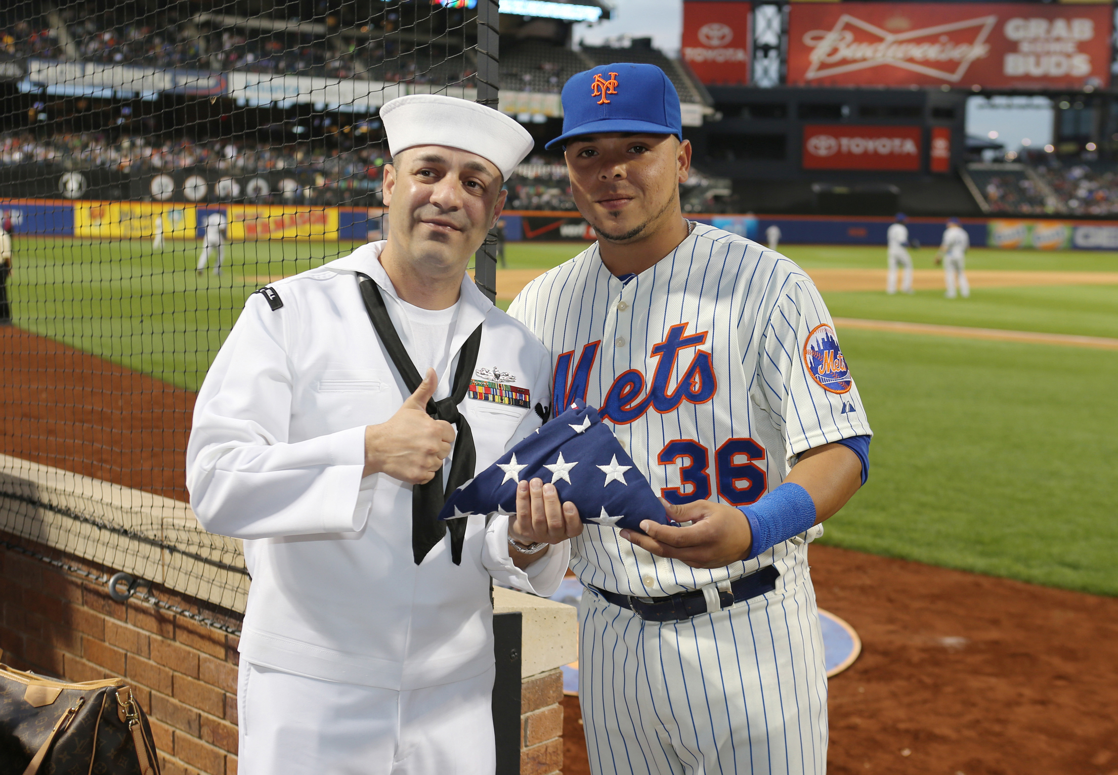 Navy Petty Officer 1st Class Anthony Costa poses for a picture with