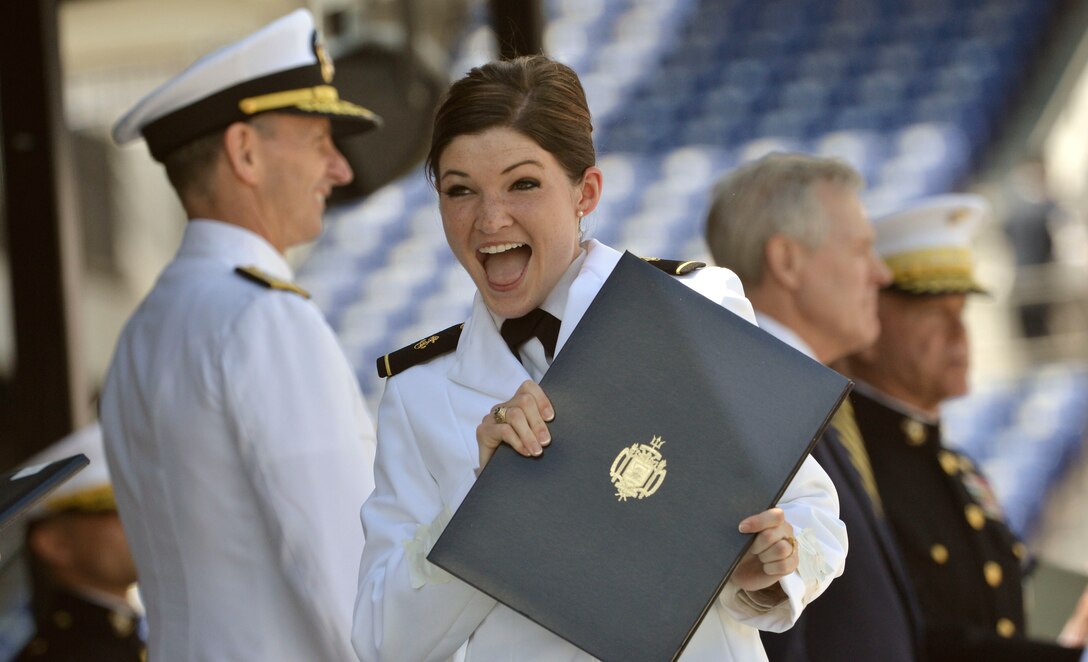 Ensign Kellie R. Hall reacts after receiving her degree on stage during ...