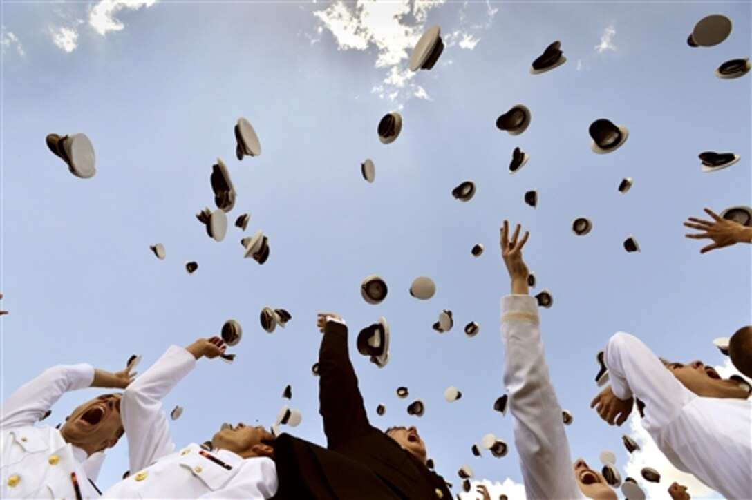 Graduating midshipmen toss their covers skyward as commencement concludes at the U.S. Naval Academy in Annapolis, Md., May 23, 2014.
