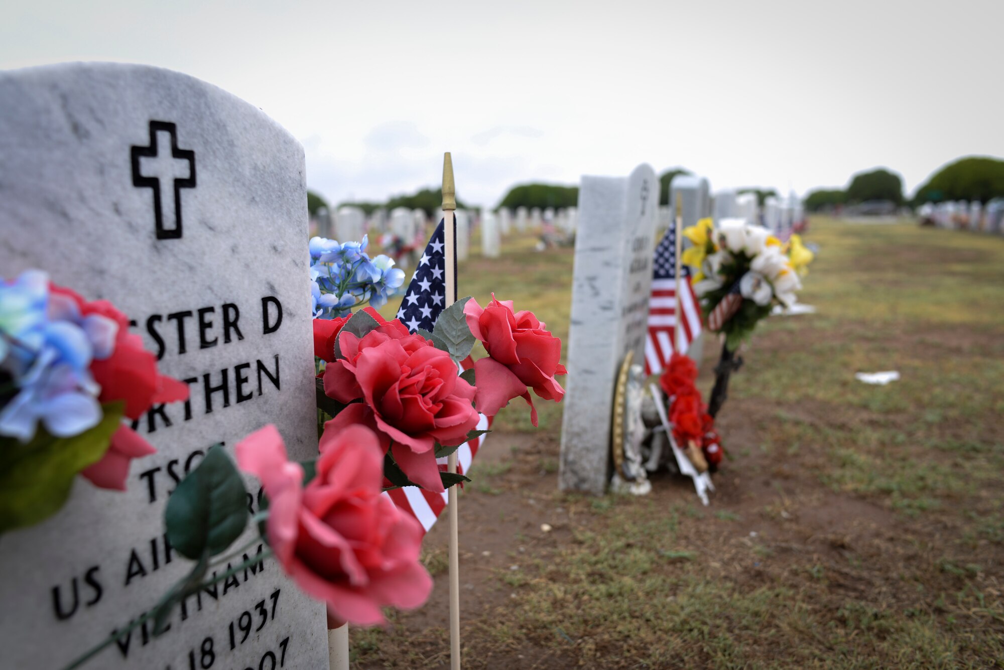 ALTUS, Okla. – U.S. flags wave next to veterans' tombstones in the Veterans Garden at the Altus City Cemetery, May 24, 2014. Airmen from Altus Air Force Base placed flags every Memorial Day weekend, which remembers the sacrifices of service members throughout U.S. history. (U.S. Air Force photo by Staff Sgt. Nathanael Callon/Released) 