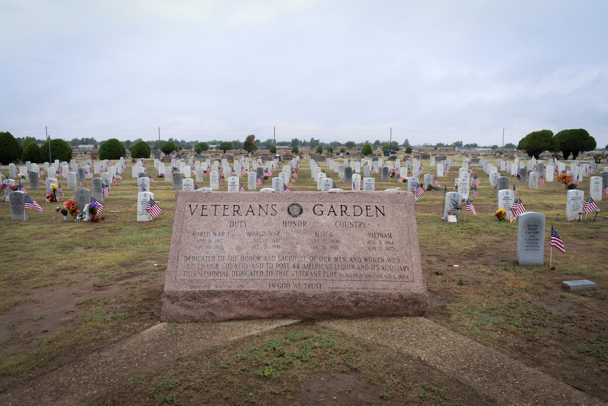 ALTUS, Okla. – U.S. flags wave next to veterans' tombstones in the Veterans Garden at the Altus City Cemetery, May 24, 2014. Airmen from Altus Air Force Base placed flags every Memorial Day weekend, which remembers the sacrifices of service members throughout U.S. history. (U.S. Air Force photo by Staff Sgt. Nathanael Callon/Released) 