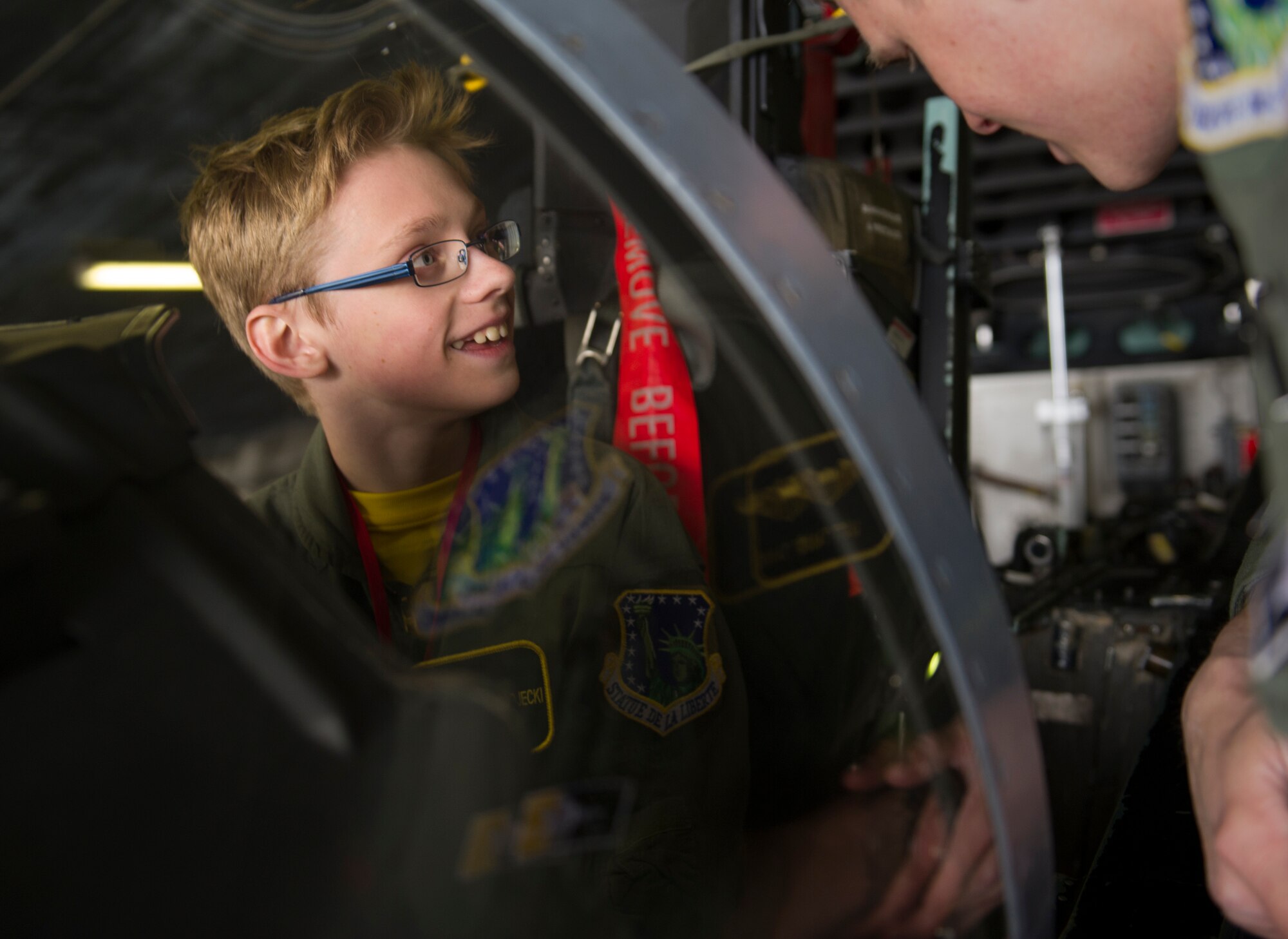 KEFLAVIK, Iceland -- Mikolaj Chojecki, 14, sits in the cockpit of an F-15C Eagle during the pilot-for-a-day program at Keflavik International Airport May 23, 2014. Airmen deployed with the 48th Air Expeditionary Group took time out of their day to brighten the lives of two children who have been struggling with serious long-term illnesses. (U.S. Air Force photo/Tech. Sgt. Benjamin Wilson)(Released)
