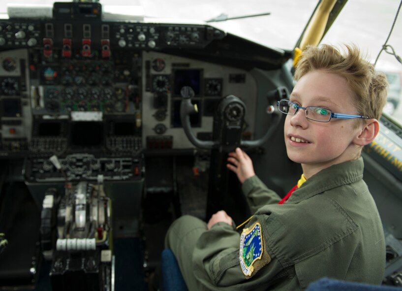 Mikolaj Chojecki, 14, sits at the controls of a KC-135 Stratotanker deployed from RAF Mildenhall during the pilot-for-a-day program May 23, 2014, at Keflavik International Airport in Iceland. Airmen deployed with the 48th Air Expeditionary Group took time out of their day to brighten the lives of two children who have been struggling with serious long-term illnesses. (U.S. Air Force photo by Tech. Sgt. Benjamin Wilson/Released) 