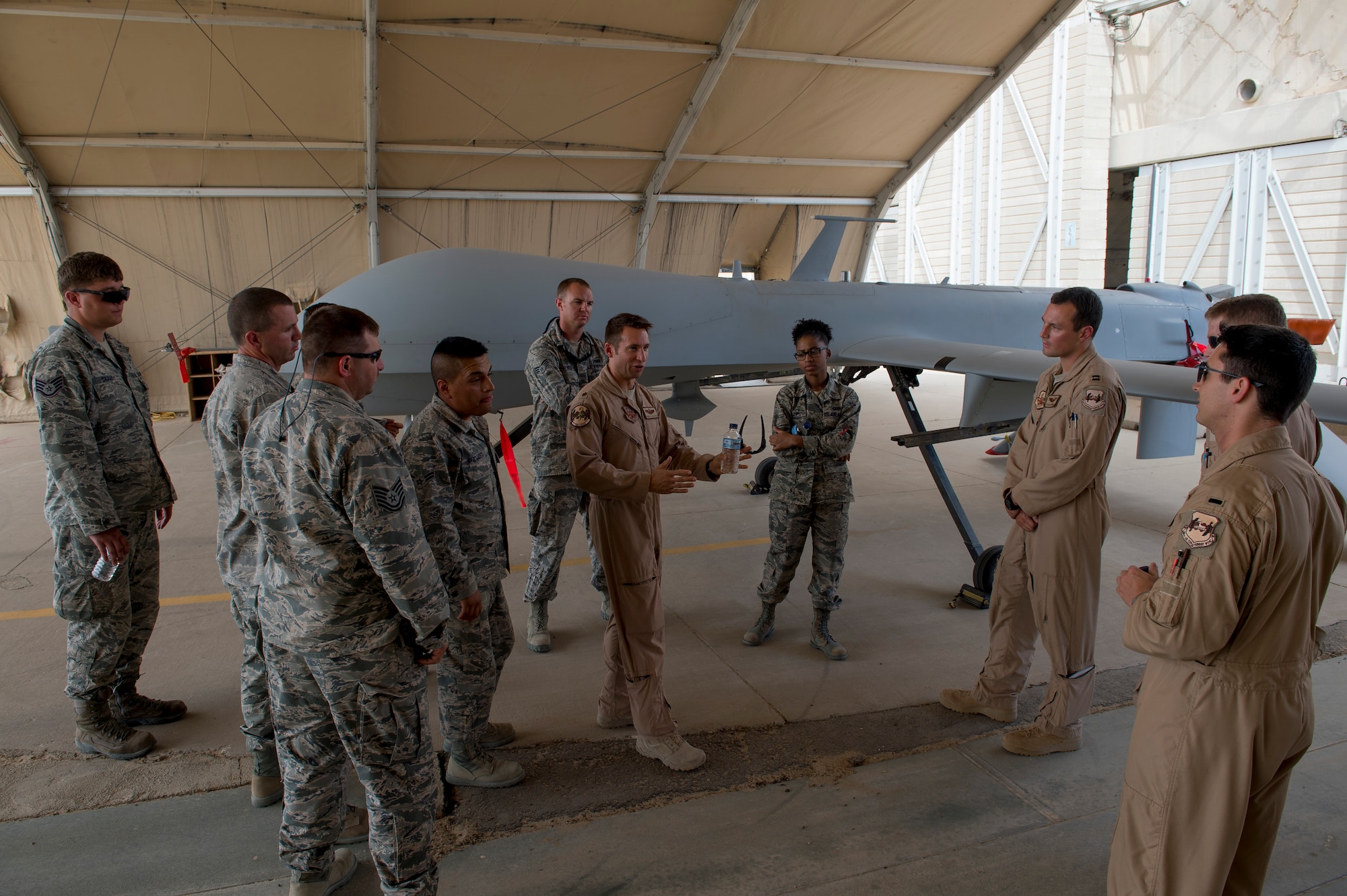 Members of the 386th Expeditionary Civil Engineering Squadron took part in the Operations Group’s Aircrew for a Day program, May 16, 2014. During the event, non-flying military members were given tours of aircraft facilities, three separate planes, and were also briefed by operations personnel on the activities that aircrew members go through on a daily basis. The tours included the 46th Expeditionary Reconnaissance Squadron, C-130 operations from the 386th Expeditionary Operations Group and Apache helicopters from the Army’s flying unit here. (U.S. Air Force photo by Staff Sgt. Jeremy Bowcock)