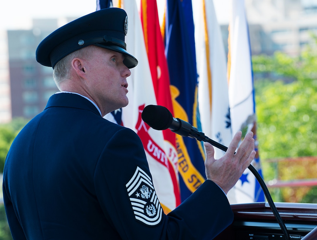Chief Master Sgt. of the Air Force James A. Cody provides his keynote speech during a Memorial Day wreath-laying ceremony held May 26, 2014, at the Air Force Memorial in Arlington, Va. Cody remarked that for him on Memorial Day the three spires of the memorial stood for freedom, fortitude and our fallen -- who are still with us in our stories and our memories, and give us cause to wave our flags. (U.S. Air Force photo/Jim Varhegyi)