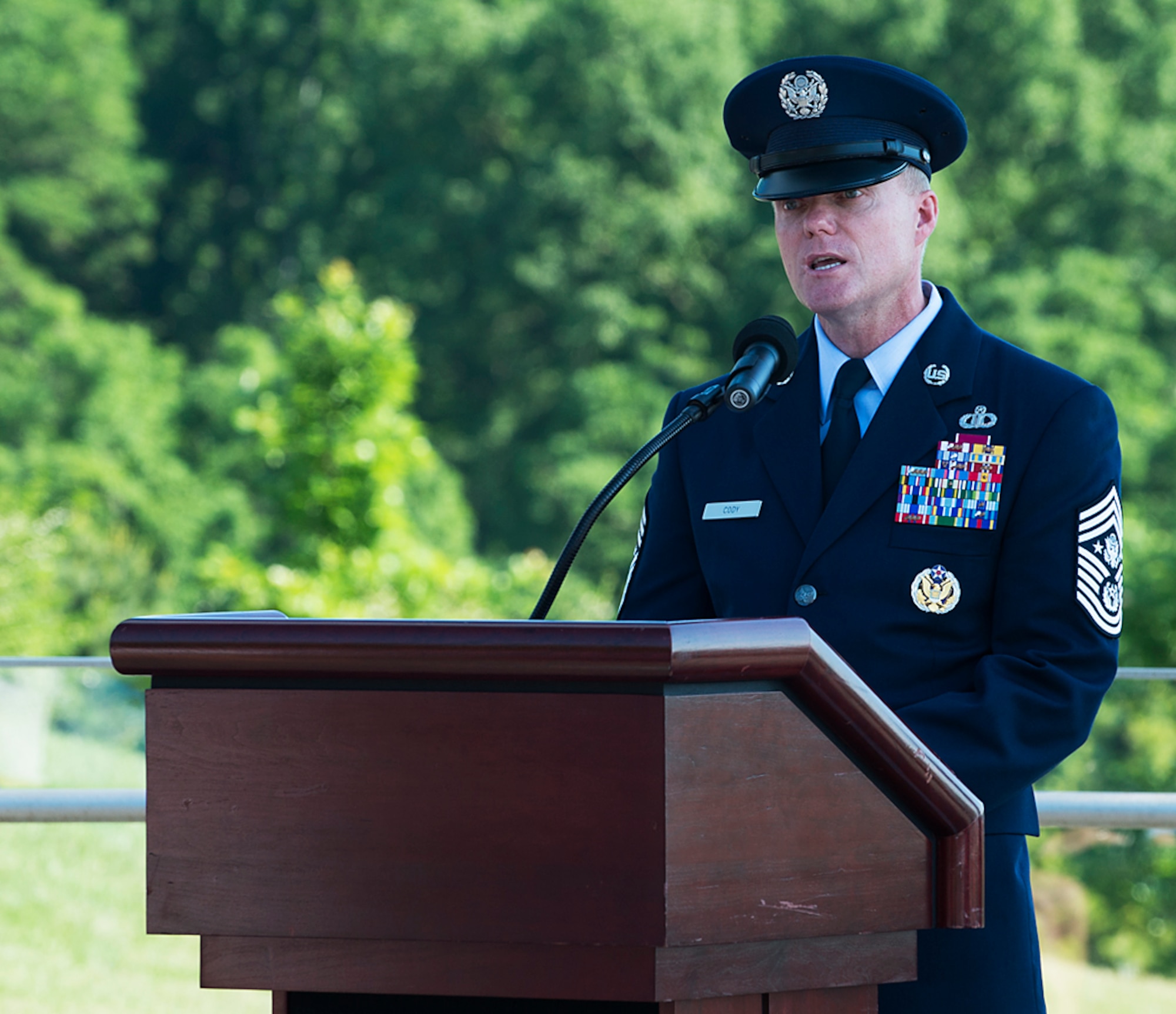 Chief Master Sgt. of the Air Force James A. Cody speaks during a Memorial Day wreath-laying ceremony held May 26, 2014, at the Air Force Memorial, Arlington, Va. Cody remarked that for him on Memorial Day the three spires of the memorial stood for freedom, fortitude and our fallen -- whose sacrifices give us cause to wave our flags today and in the future. (U.S. Air Force photo/Jim Varhegyi)