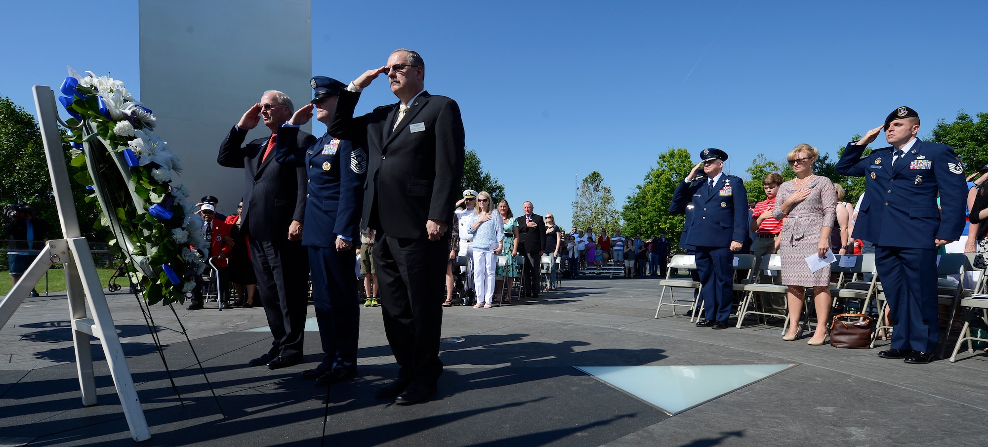 From right, Air Force Sergeant's Association International President retired Chief Master Sgt. Daniel Yeomans, Chief Master Sgt. of the Air Force James A. Cody and Air Force Association President retired Gen. Craig McKinley lay a Memorial Day wreath during a ceremony held at the Air Force Memorial,  May 26, 2014, in Arlington, Va. Cody provided the keynote speech remarking that for him, on Memorial Day, the three spires of the memorial stood for freedom, fortitude and our fallen. Cody then told the crowd that today, and everyday, our fallen are with us in our stories and our memories, and they give us cause to wave our flags. (U.S. Air Force photo/Jim Varhegyi)