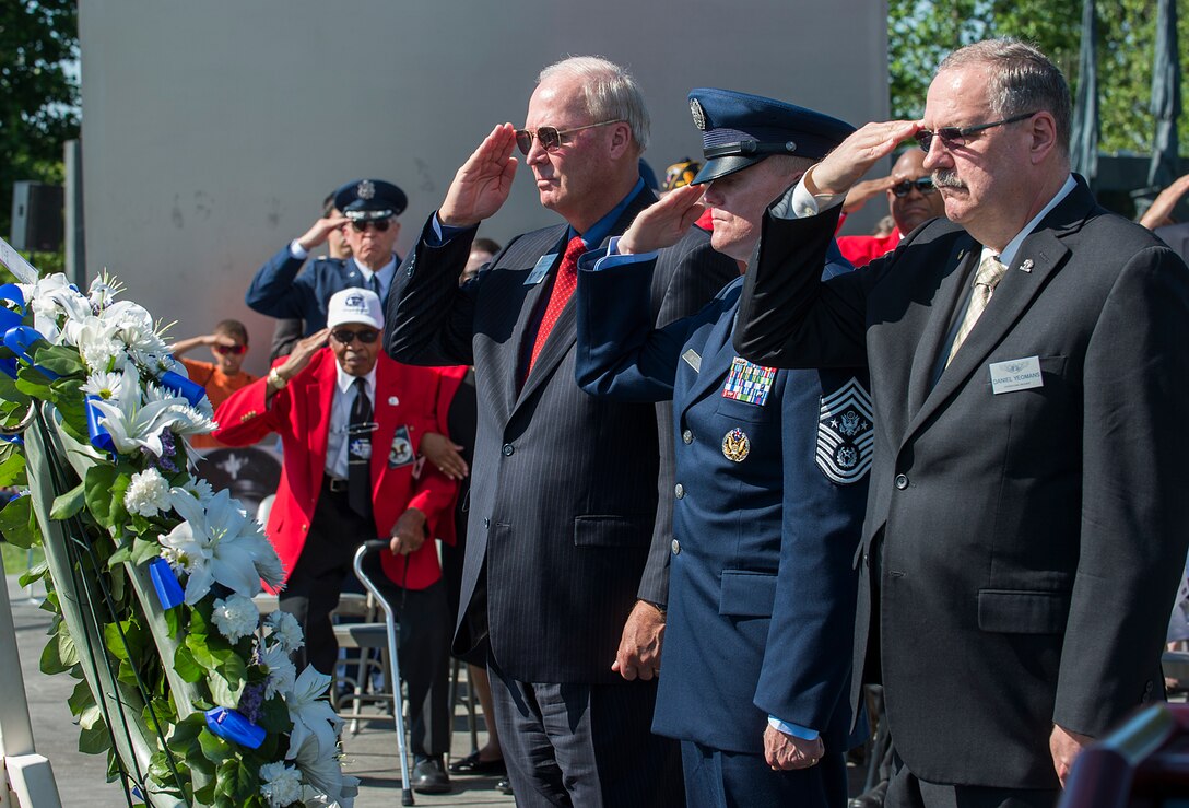 From right, Air Force Sergeant's Association International President retired Chief Master Sgt. Daniel Yeomans, Chief Master Sgt. of the Air Force James A. Cody and Air Force Association President retired Gen. Craig McKinley lay a Memorial Day wreath during a ceremony held at the May 26, 2014, Air Force Memorial, Arlington, Va. Cody provided the keynote speech remarking that for him on Memorial Day is a day to remember the freedom that we all share because of the fortitude shown by of our fallen comrades in fighting and standing their ground. (U.S. Air Force photo/Jim Varhegyi)