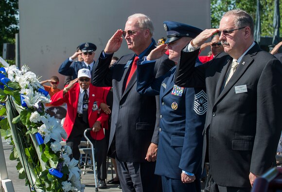 From right, Air Force Sergeant's Association International President retired Chief Master Sgt. Daniel Yeomans, Chief Master Sgt. of the Air Force James A. Cody and Air Force Association President retired Gen. Craig McKinley lay a Memorial Day wreath during a ceremony held May 26, 2014, at the Air Force Memorial in Arlington, Va. Cody provided the keynote speech, remarking that for him Memorial Day is a day to remember the freedom that we all share because of the fortitude shown by of our fallen comrades in fighting and standing their ground. (U.S. Air Force photo/Jim Varhegyi)