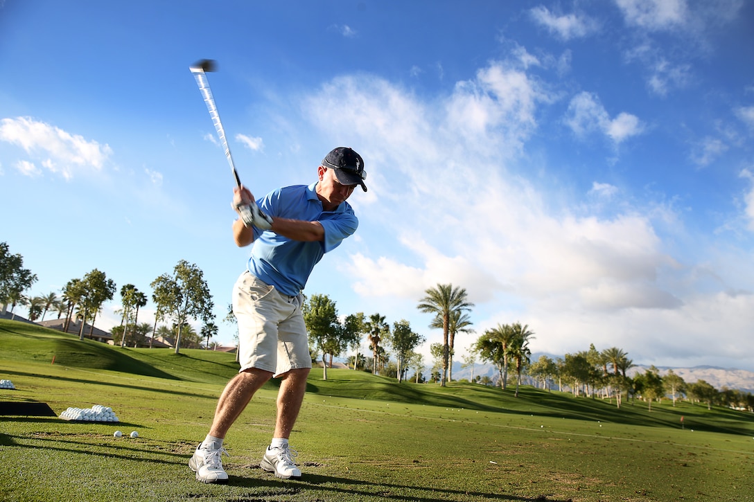 Staff Sgt. Bradley Wells, instructor, Marine Corps Communication-Electronics School, practices on the driving range during the 7th Annual Heritage Palms Marine Day for food, fun and golf in Indio, Calif., April 2. The Marines integrated into four-man scramble teams with members of the club in a tournament.