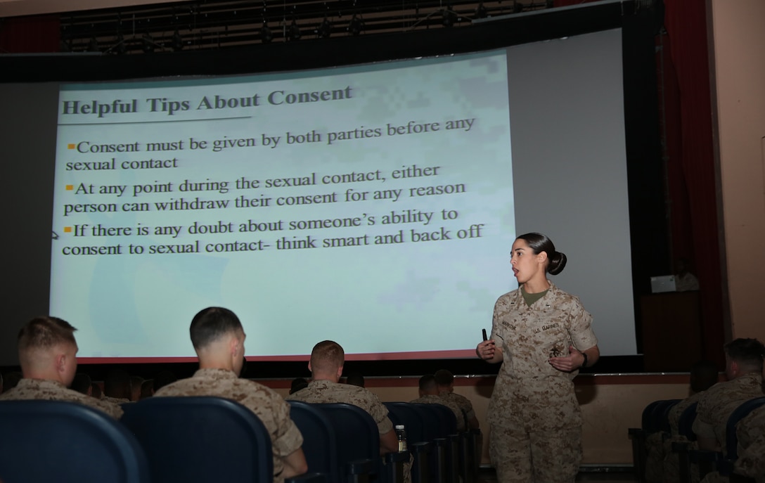 1st Lt. Julie Markow, uniform victim advocate, Headquarters Battalion, explains mutual consent during the battalion operational pause hosted at the Sunset Cinema, Tuesday. The Sexual Assault Prevention and Response portion gave Marines insight into Marines who have gone through incidents of that nature.