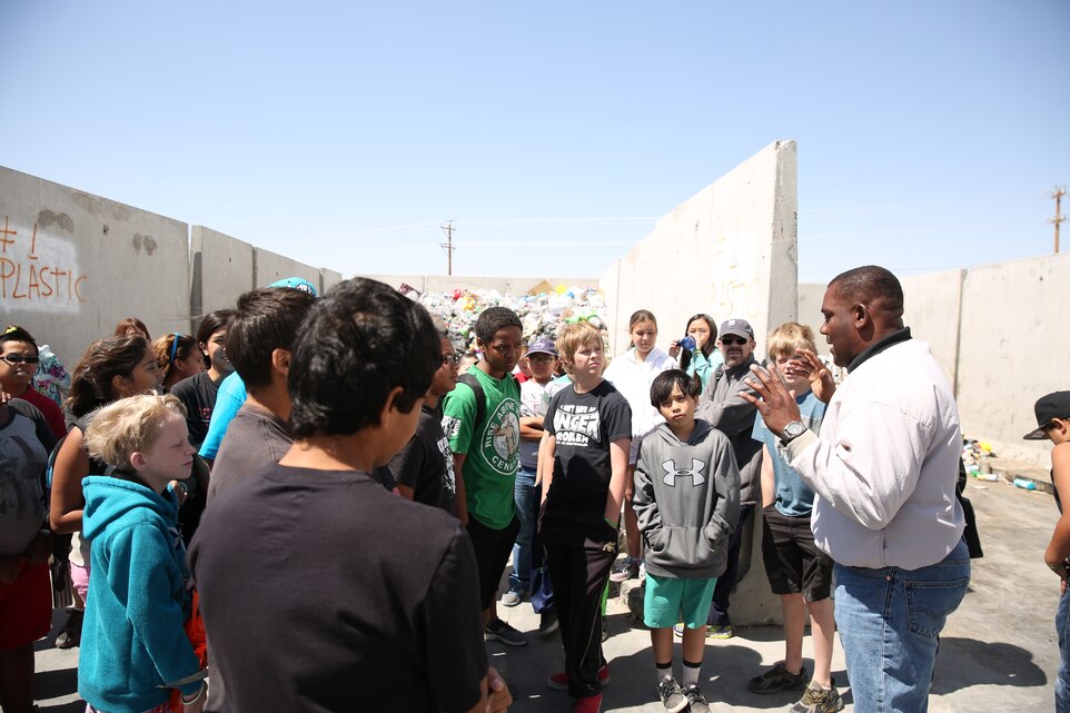 Students from Oasisi Elementary learn about the the recycling of industrial and everyday materials at the Combat Center's recycling centers Tuesday. The students' vist provided hands-on lessons as part of their science trip to the base.