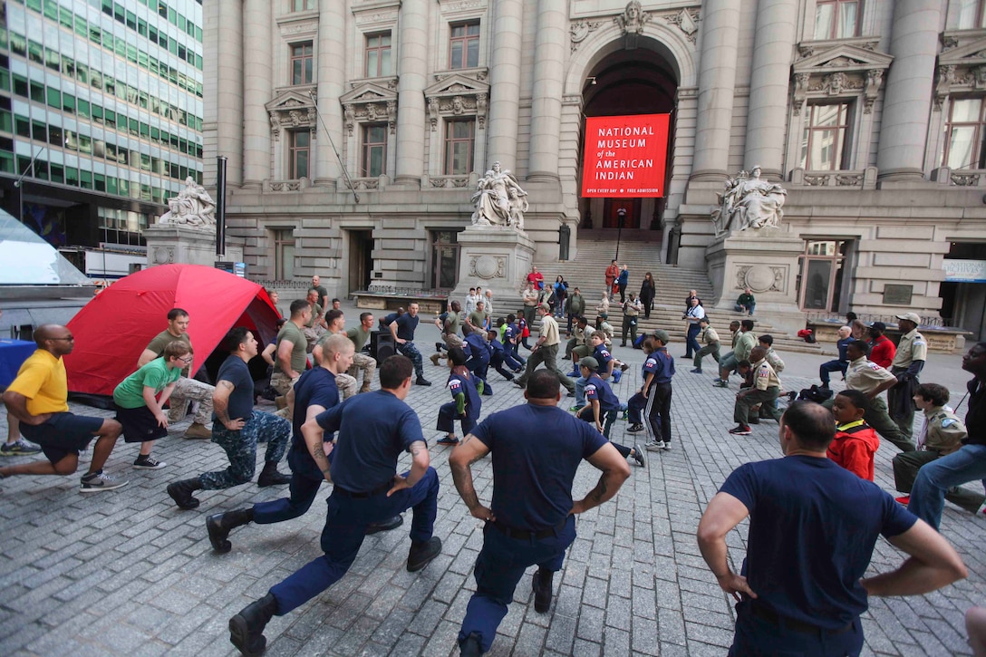 NEW YORK— Boy scouts execute lunges during a physical fitness session ran by U.S. Sailors, U.S. Marines and the U.S. Coast Guard in Bowling Green park, May 23.  The Boy Scout’s PT is one of many community relations events that took place during Fleet week New York City 2014. (U.S. Marine Corps photo by Lance Cpl. Brandon Thomas)