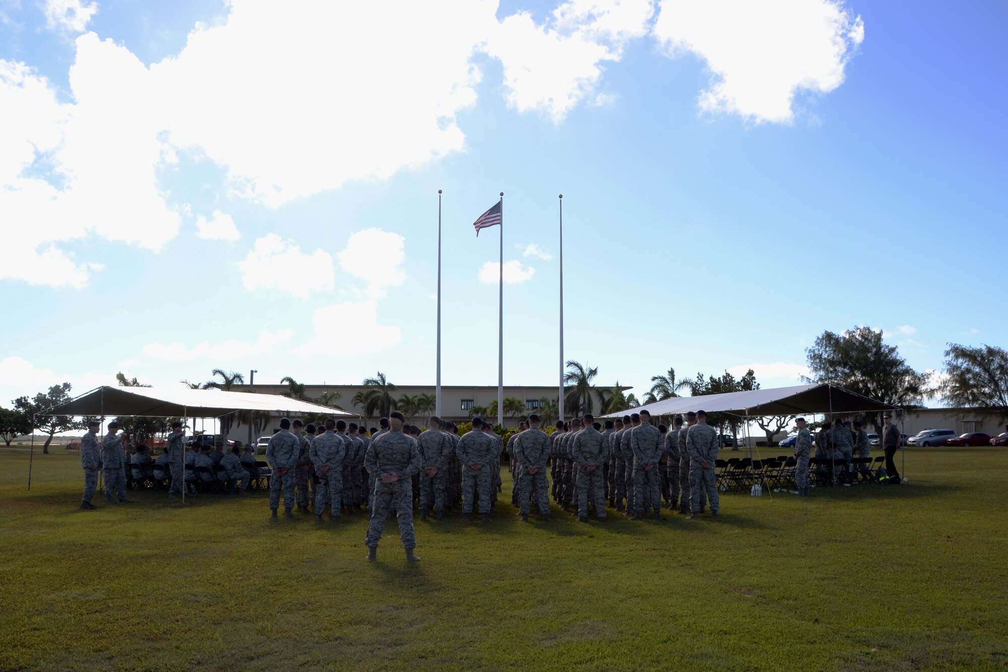 36th and 736th Security Forces Squadron Airmen stand in formation for a retreat ceremony May 14, 2014, on Andersen Air Force Base, Guam. Andersen recognized law enforcement professionals during National Police Week by coordinating multiple events to honor them and their families for the sacrifices they have made. (U.S. Air Force photo by Airman 1st Class Amanda Morris/Released)
