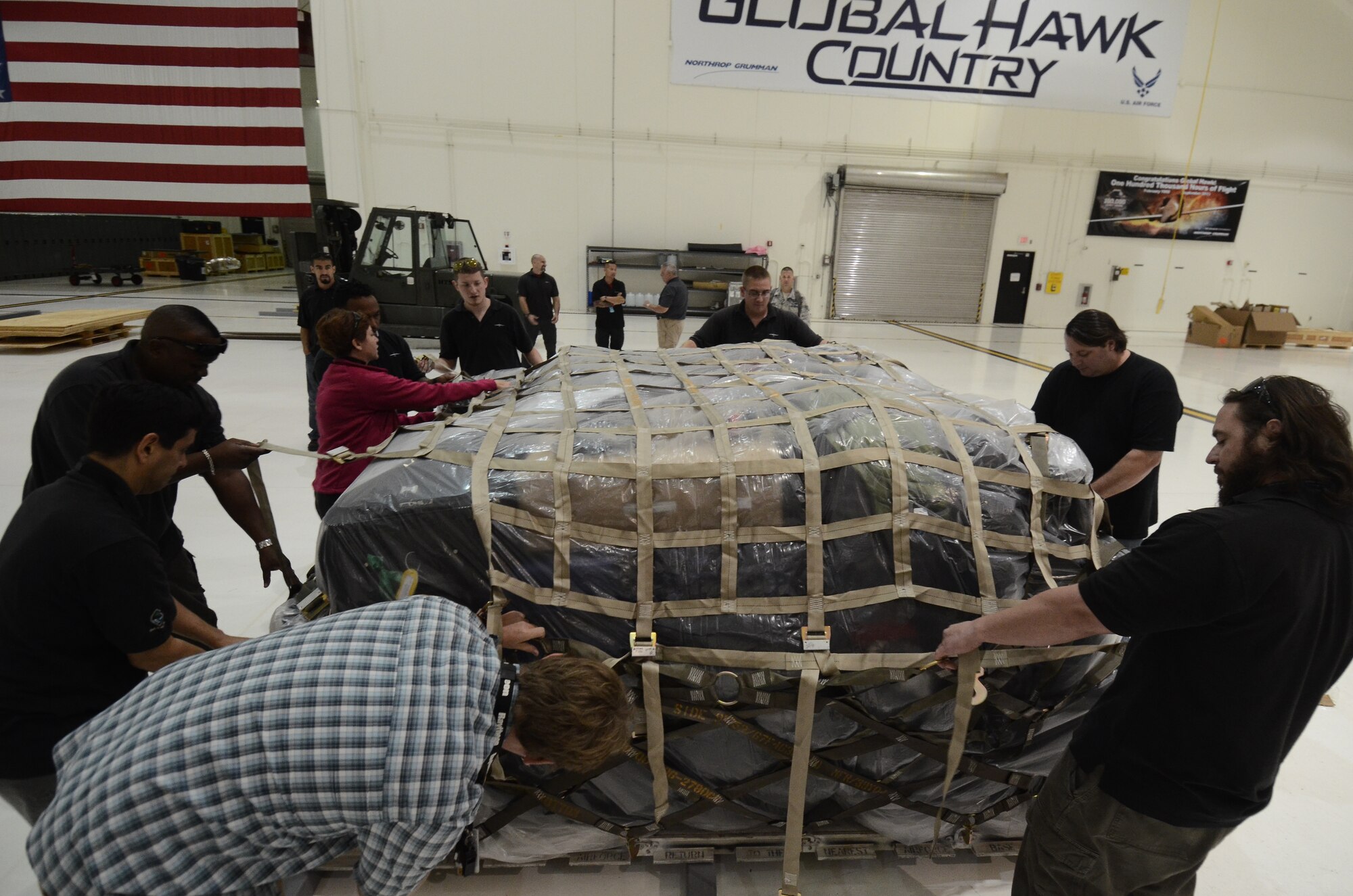 Members of the 69th Reconnaissance Group Detachment 1 secure a pallet of luggage prior to deploying to Misawa Air Base, Japan, May 15, 2014, on Andersen Air Force Base, Guam. The detachment is deploying to Misawa to continue providing intelligence, surveillance and reconnaissance support in the Pacific during Guam’s rainy season.  (U.S. Air Force photo by Airman 1st Class Emily A. Bradley/Released)