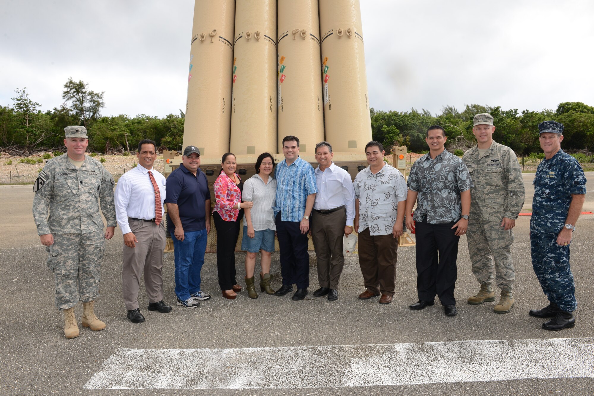 Guam senators pose with Andersen Air Force Base leadership in front of the Terminal High Altitude Area Defense system at Northwest Field, Guam on May 7, 2014. The senators were visiting the site to gain a deeper understanding of the THAAD mission, which has been at Andersen since April 2013. (U.S. Air Force photo by Airman 1st Class Adarius Petty/Released)