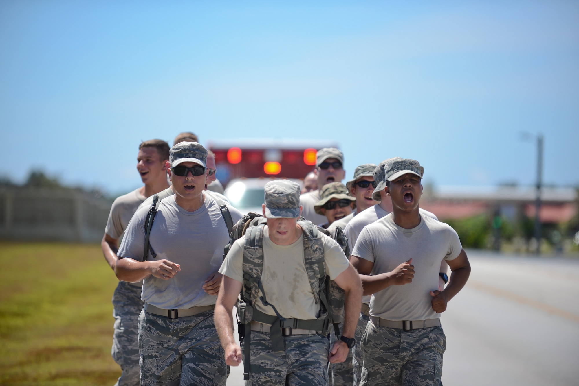 Members of the 36th Security Forces Squadron jog down Arc Light Boulevard during National Police Week May 15, 2014, on Andersen Air Force Base, Guam. The squadron conducted a ruck march to honor the memory of fallen defenders around the globe. (U.S. Air Force photo by Airman 1st Class Adarius Petty/Released)