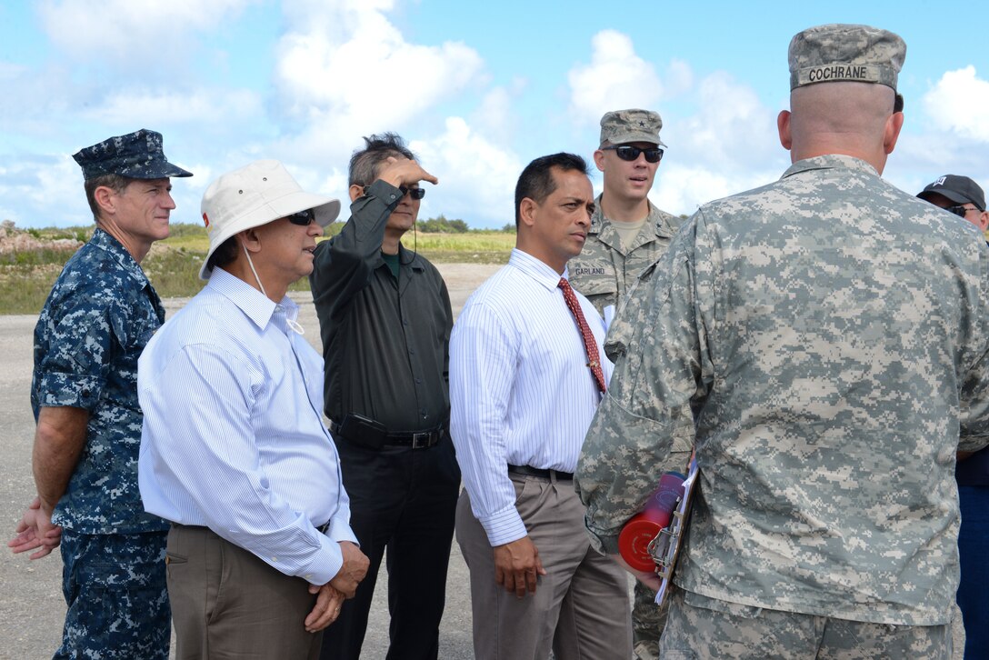 Lt. Col. Clyde Cochrane, commander of Task Force Talon, speaks to a group of Guam Senators at Northwest Field, Guam on May 7, 2014. The senators were visiting the site to gain a deeper understanding of the THAAD mission, which has been at Andersen since April 2013. (U.S. Air Force photo by Airman 1st Class Adarius Petty/Released)