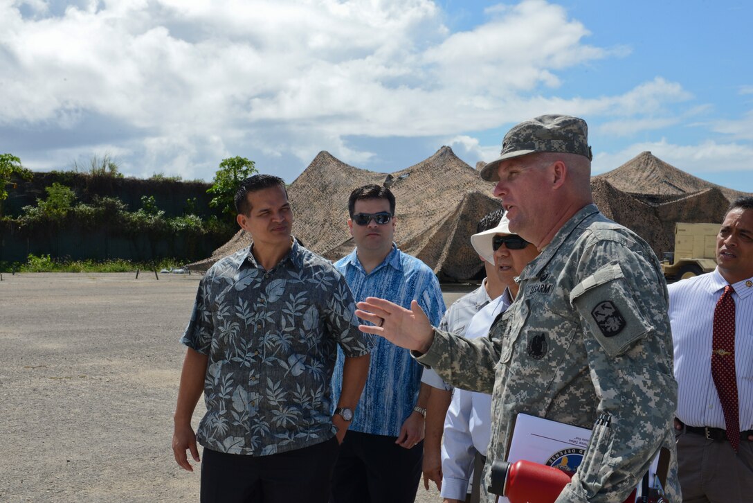 Lt. Col. Clyde Cochrane, commander, Task Force Talon, speaks to a group of Guam Senators at Northwest Field, Guam on May 7, 2014. The senators were visiting the site to gain a deeper understanding of the THAAD mission, which has been at Andersen since April 2013. (U.S. Air Force photo by Airman 1st Class Adarius Petty/Released)