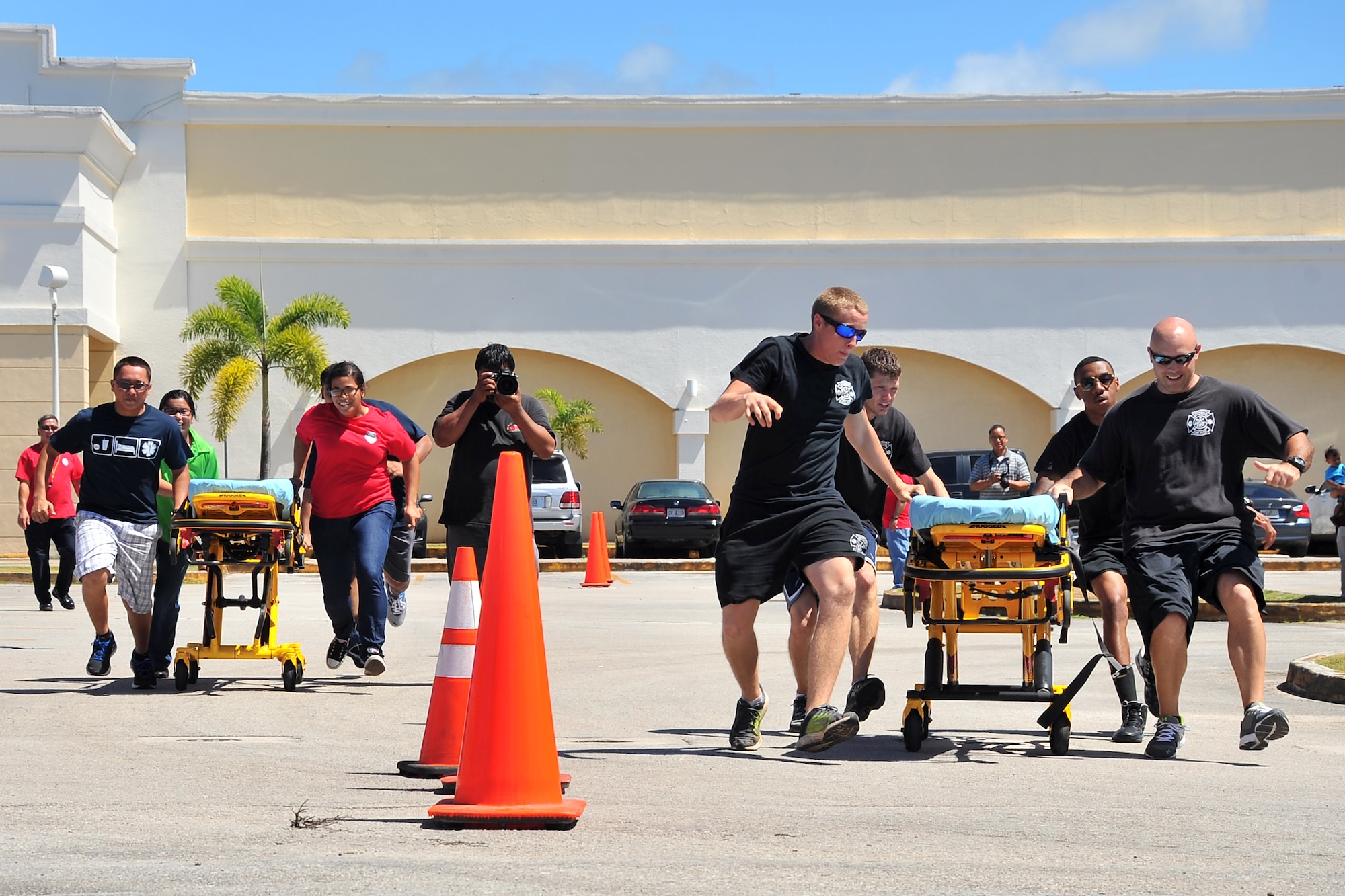 Team Andersen first responders compete against another team in an Emergency Medical Services Rodeo at the Agana Shopping Center, Guam, May 18, 2014. Team Andersen placed first in the event, which was part of a public health fair in recognition of EMS week. (U.S. Air Force photo by Staff Sgt. Melissa B. White/Released)