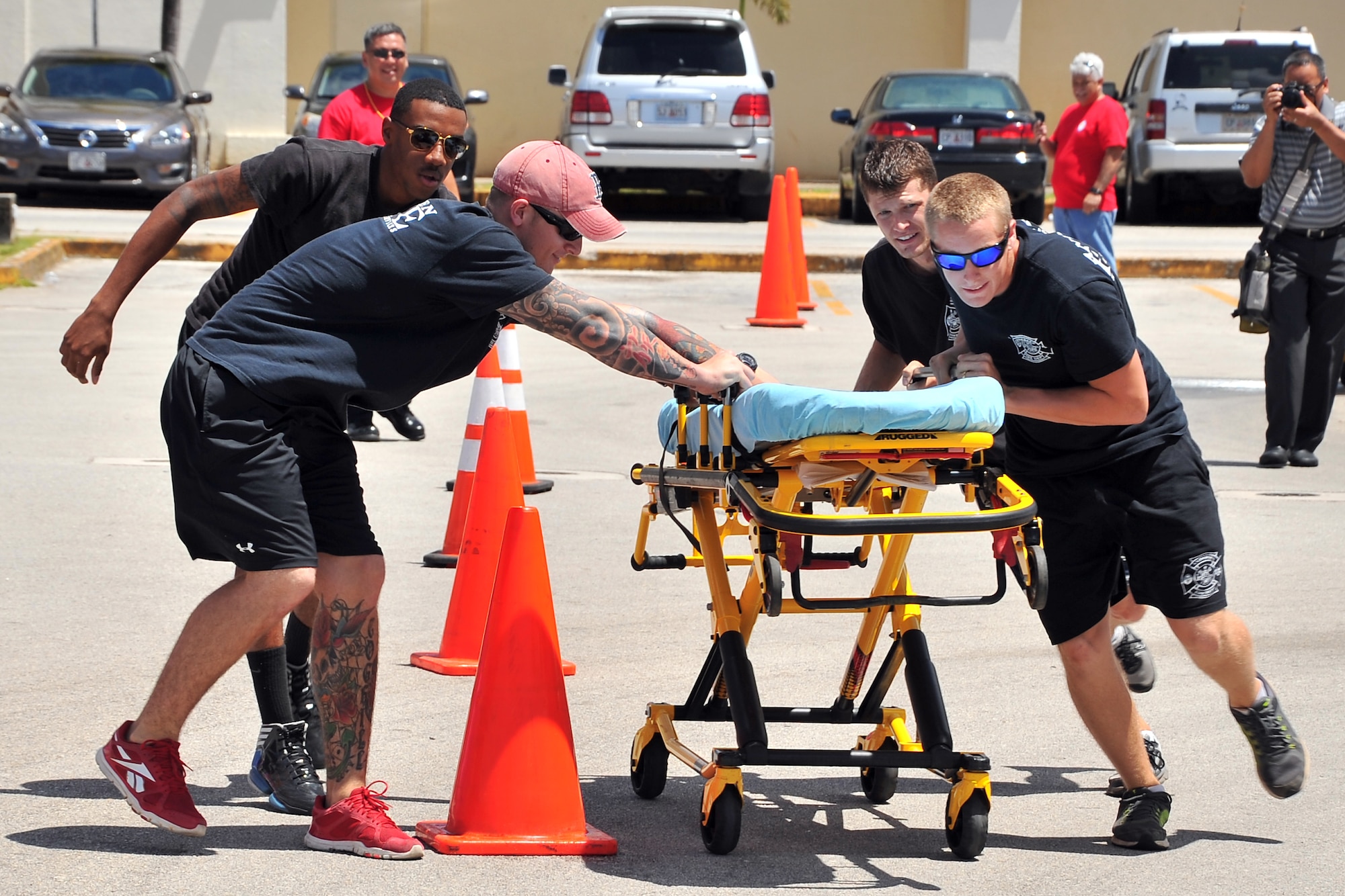 Team Andersen first responders participate in an Emergency Medical Services Rodeo at the Agana Shopping Center, Guam, May 18, 2014. Team Andersen placed first in the event, which was part of a public health fair in recognition of EMS week. (U.S. Air Force photo by Staff Sgt. Melissa B. White/Released)