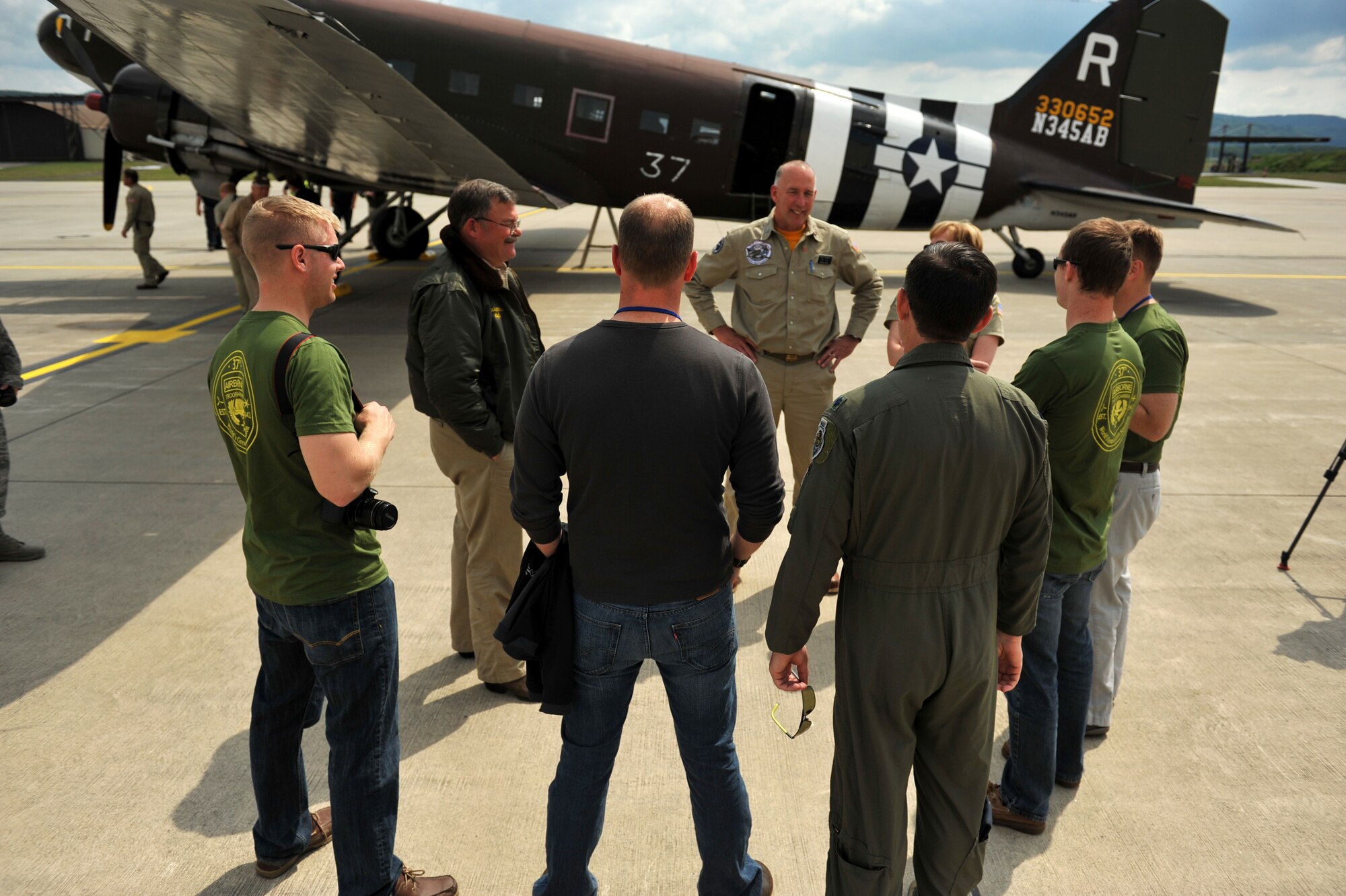 Members of the 37th Airlift Squadron meet with crew members of a Douglas C-47 Skytrain troop carrier aircraft, designated Whiskey 7, just after landing the aircraft at Ramstein Air Base, May 26, 2014. Whiskey 7 was the lead carrier of 37th Troop Carrier Squadron that took part in dropping the 82nd Airborne Division near St. Mere Eglise, France during D-Day, June 6th, 1944. The historical aircraft landed at Ramstein before heading to Normandy to take part in commemoration events for the 70th Anniversary of D-Day. (U.S. Air Force photo/Staff Sgt. Sara Keller)