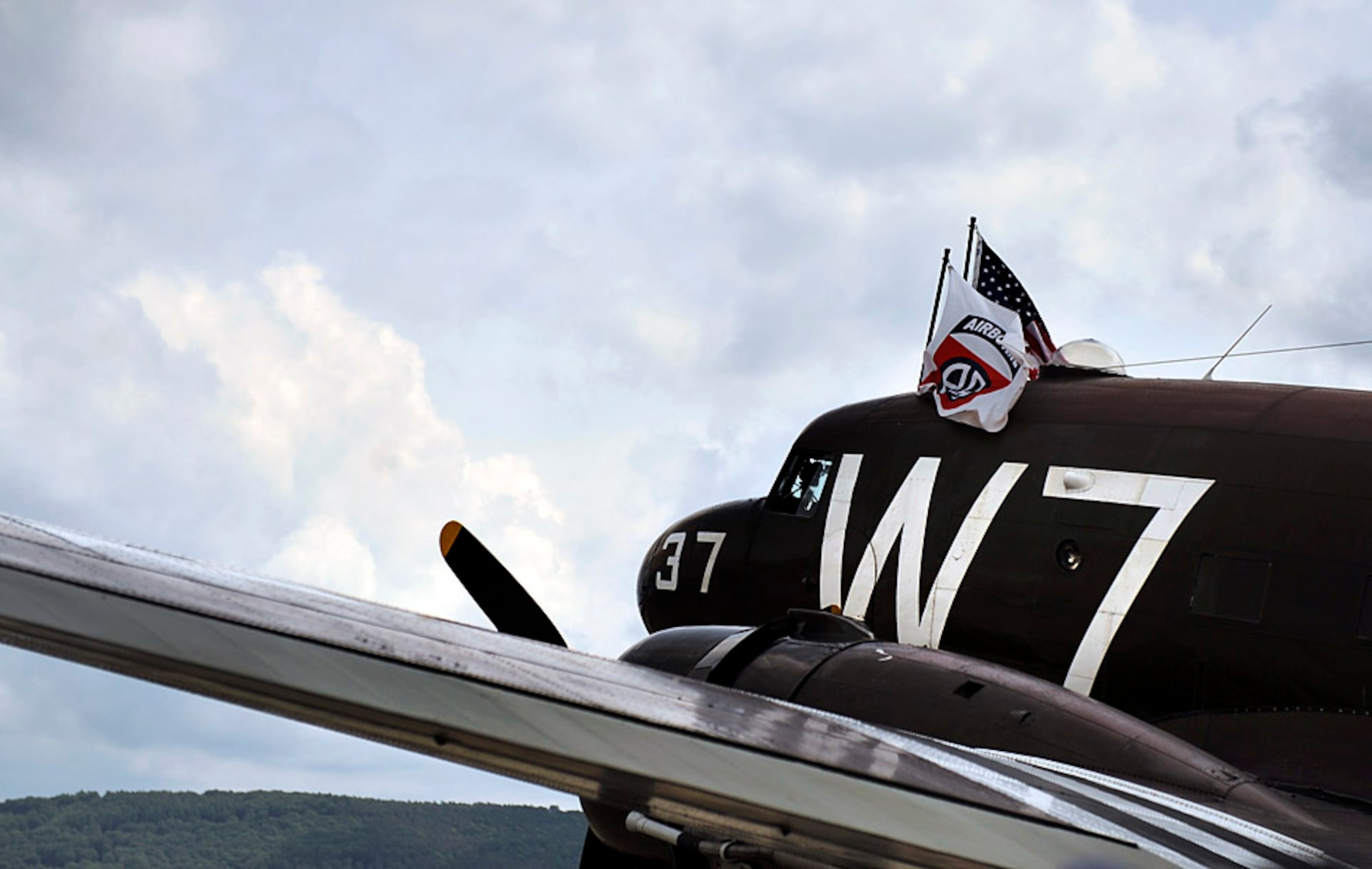 A Douglas C-47 Skytrain troop carrier aircraft, designated Whiskey 7, lands at Ramstein Air Base, May 26, 2014. Whiskey 7 was the lead carrier of 37th Troop Carrier Squadron that took part in dropping the 82nd Airborne Division near St. Mere Eglise, France during D-Day, June 6th, 1944. The historical aircraft landed at Ramstein before heading to Normandy to take part in commemoration events for the 70th Anniversary of D-Day. (U.S. Air Force photo/Staff Sgt. Sara Keller)
