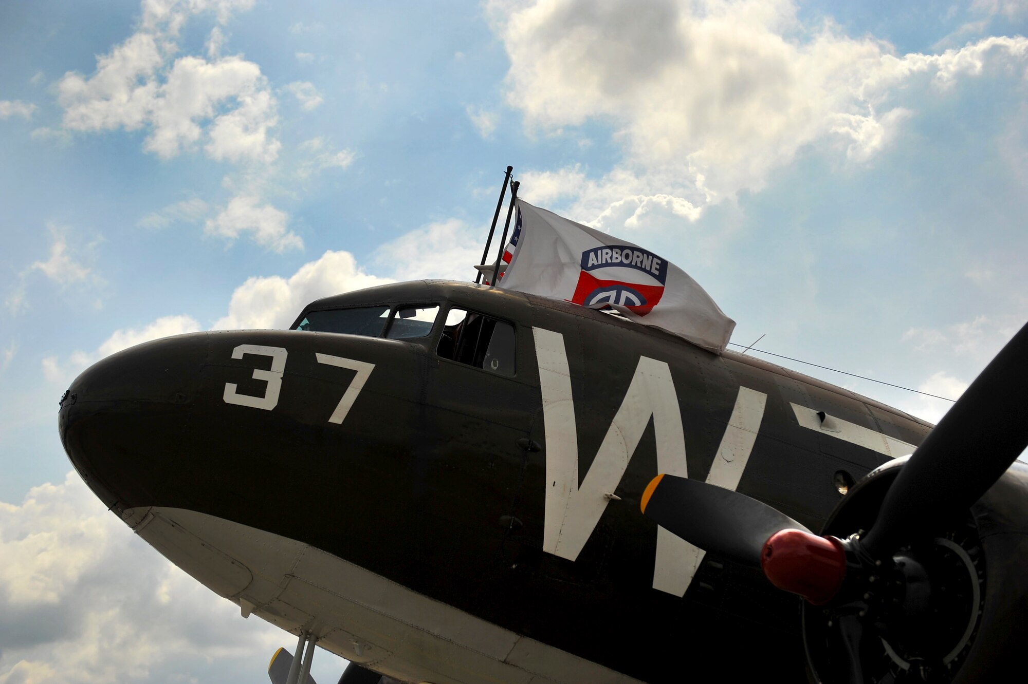A Douglas C-47 Skytrain troop carrier aircraft, designated Whiskey 7, lands at Ramstein Air Base, May 26, 2014. Whiskey 7 was the lead carrier of 37th Troop Carrier Squadron that took part in dropping the 82nd Airborne Division near St. Mere Eglise, France during D-Day, June 6th, 1944. The historical aircraft landed at Ramstein before heading to Normandy to take part in commemoration events for the 70th Anniversary of D-Day. (U.S. Air Force photo/Staff Sgt. Sara Keller)