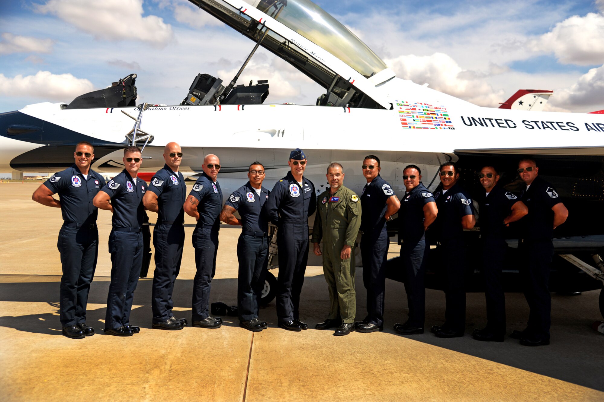 Ronnie Marez, the hometown hero selected by the Thunderbirds for a once-in-a-lifetime flight in an F-16C, poses with the Thunderbird 7 Crew after an hour-long flight on the aircraft.  Marez endured more than seven Gs and flew at speeds in excess of 500 miles per hour. (U.S. Air Force Photo/Airman 1st Class Chip Slack)