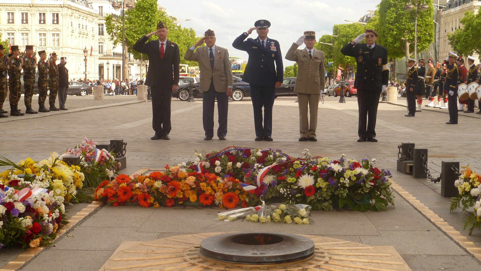PARIS, France --  Lt. Gen. Tom Jones, U.S. Air Forces in Europe and Air Forces Africa vice commander (center), renders a salute with French civilian and military counterparts at the Tomb of the Unknown Soldier May 25, 2014, during a Memorial Day wreath-laying ceremony at the Arc de Triomphe in Paris. The Unknown French Soldier died during WWI and is buried beneath the Arc de Triomphe. While his identity is still unknown, he is daily remembered with fresh wreaths and an eternal flame. The inscription above his tomb reads, “Here rests a French soldier who died for his country.” (U.S. Air Force photo/Capt. Reba Good)