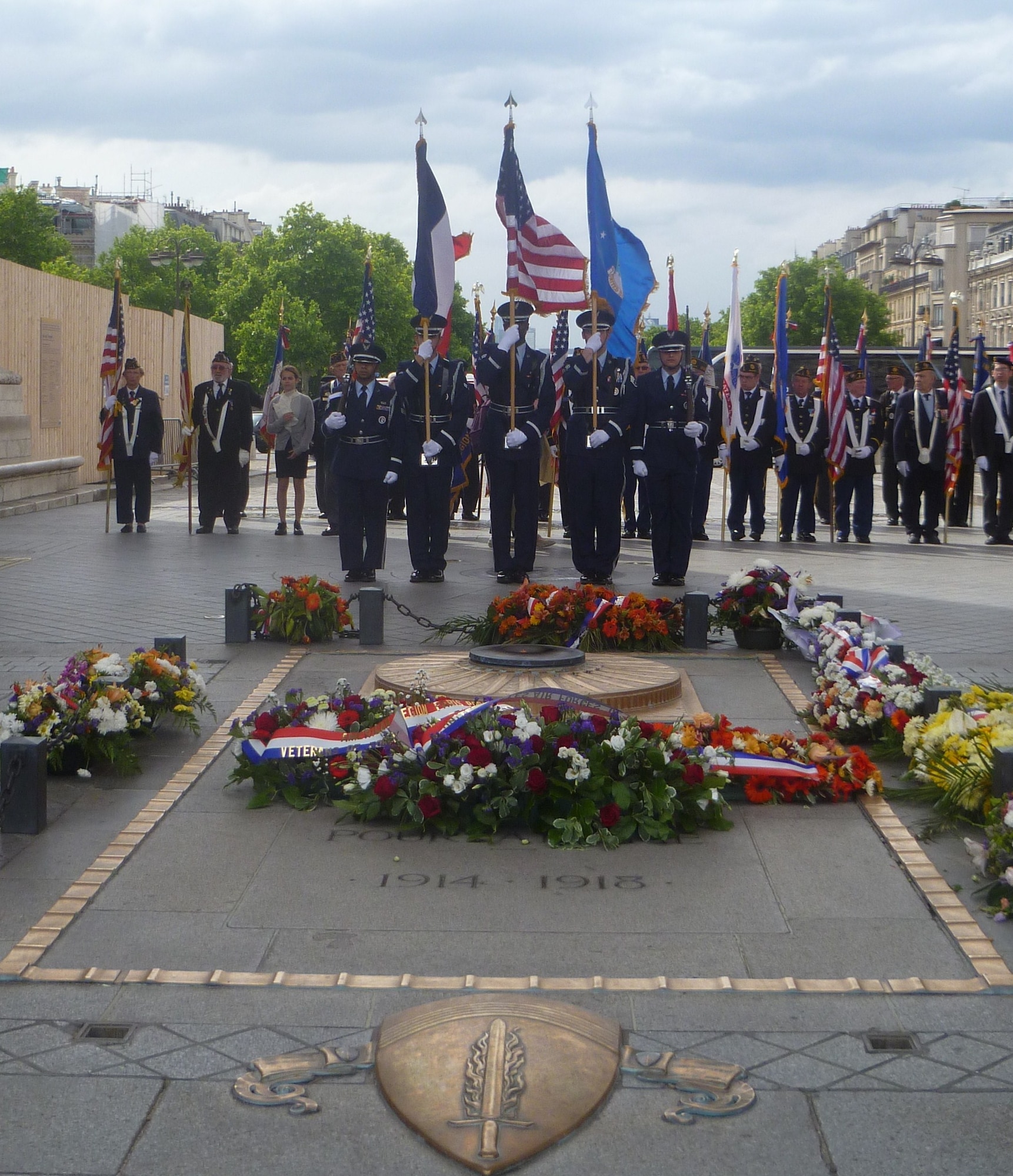 PARIS, France – The U.S. Air Forces in Europe and Air Forces Africa Honor Guard presents the colors to honor the Unknown French Soldier buried beneath the Arc de Triomphe in Paris May 25, 2014. The Unknown French Soldier died during WWI and is buried beneath the Arc de Triomphe. While his identity is still unknown, he is daily remembered with fresh wreaths and an eternal flame. The inscription above his tomb reads, “Here rests a French soldier who died for his country.” (U.S. Air Force photo/Capt. Reba Good)