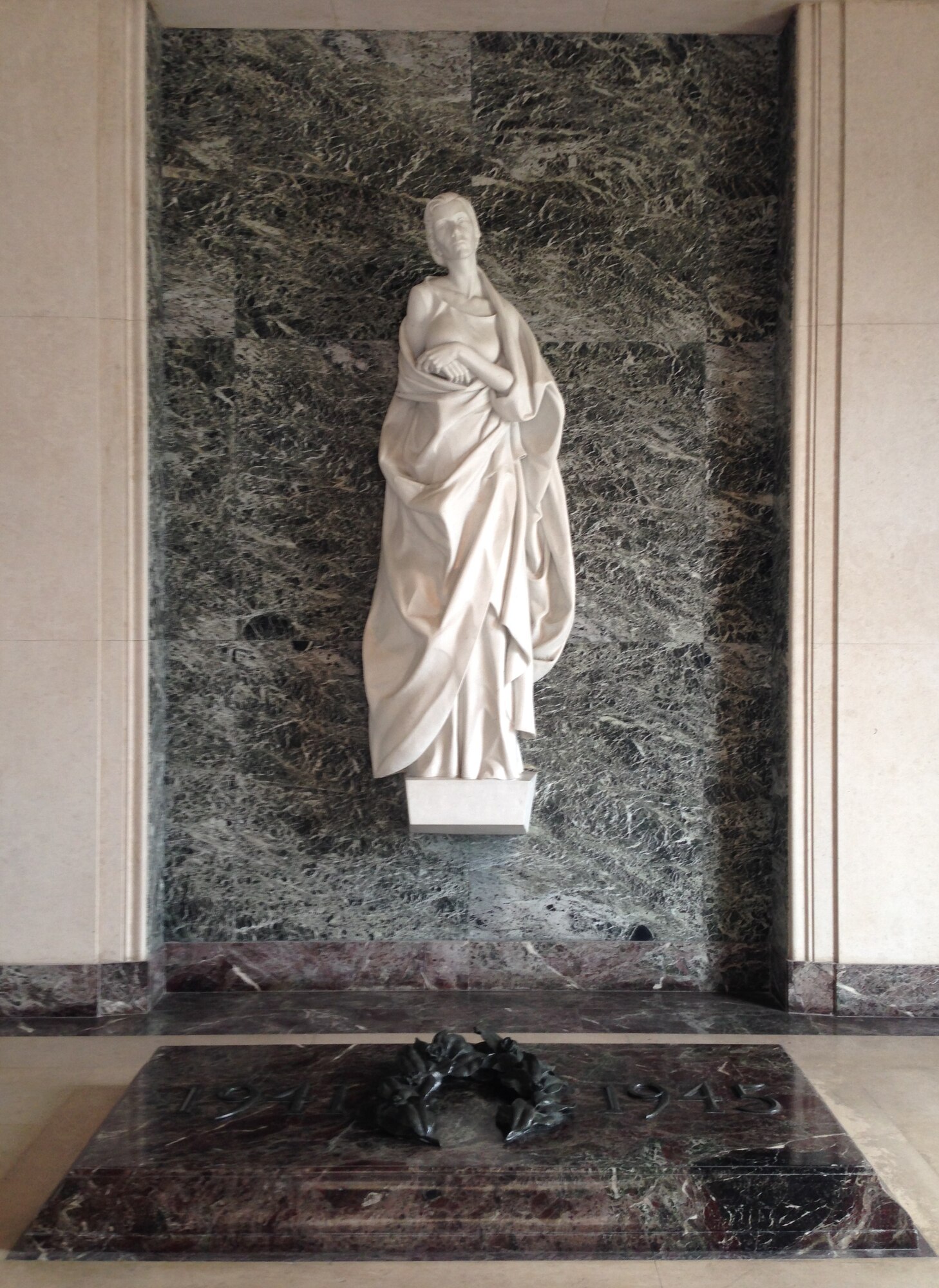SURESNES, France –Two hundred French and U.S. service members and civilians gathered at Suresnes Cemetery, just outside Paris May 25, 2014, to honor fallen Americans who fought and died during the two world wars. This white marble statue, named “Memory,” stands in the WWII memorial room of the cemetery with an inscription reading, “Let us here highly resolve that these honored dead shall not have died in vain.” (U.S. Air Force photo/Capt. Reba Good)