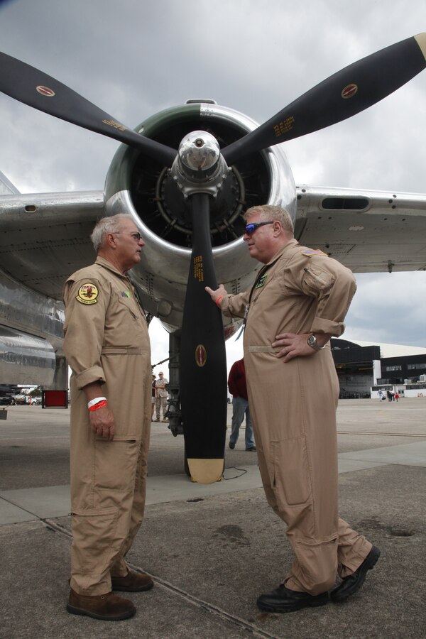 Members of the Disabled American Veterans Flight Team talk beside “Panchito,” a B-25 Mitchell bomber, during the 2014 Marine Corps Air Station Cherry Point Air Show May 18. B-25 bombers are most known for their role in the Doolittle Raid. The raid was an early American operation during WWII launched on the Tokyo and other places on Honshu Island. It was the first air raid to strike the Japanese home Islands in retaliation for the Japanese attack on Pearl Harbor. 