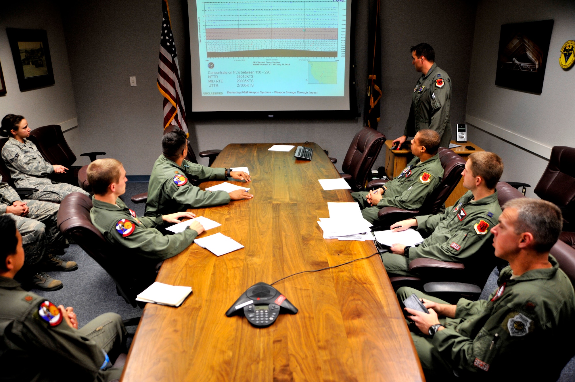 Members of the 11th Reconnaissance Squadron receive a pre-flight briefing May 12, 2014, at Creech Air Force Base, Nev. The 1th RS flew the MQ-9 Reaper in a week-long mission, known as Combat Hammer, where they released the GBU-12 Paveway II and AGM-114 Hellfire munitions. (U.S. Air Force photo/Airman 1st Class C.C.)