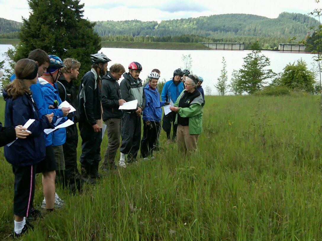 On May 10, 2014, over 30 people braved the rain to participate in the First Bikes to Blooms event at Dorena Reservoir. This event is a multi-agency and partner effort to encourage people to spend time outdoors biking on the Row River Trail and to view wildflowers in bloom in native prairie remnants managed by the Corps of Engineers.

Botanist Wes Messinger and Park Ranger Christie Johnson presented interpretive talks on the plants and Dorena Dam. This event is the first accomplishment of a recently formed partnership to promote wildflowers along the Row River Trail corridor. The Bureau of Land Management manages the trail, which spans the length of Dorena Reservoir, providing access to two Corps-managed day-use areas. The trail connects Cottage Grove to federal lands above the Dorena Reservoir. This event also marked the re-opening of Bake Stewart Park under new management objectives. 

The Willamette Valley Project converted Bake Stewart to a walk-in park to reduce impacts to the native prairie remnants, while focusing on the quality recreation opportunities that can be experienced without vehicles. This change also reduces operational costs and is expected to improve the recreation metrics for that park. To support the management change, the Willamette Valley Project built a trail connecting the park to the Row River Trail to encourage users to bike to Bake Stewart as a destination from one of the many trailheads. 

The connector trail and many other changes were funded by the monetary award from the Willamette Valley Project winning the 2011 Natural Resource Management Project of the Year Award. The WVP was also selected to receive Handshake funds this year, which will allow the Corps to continue working with partners on restorating the native prairie remnants, and also to develop and install interpretive panels along the trail.