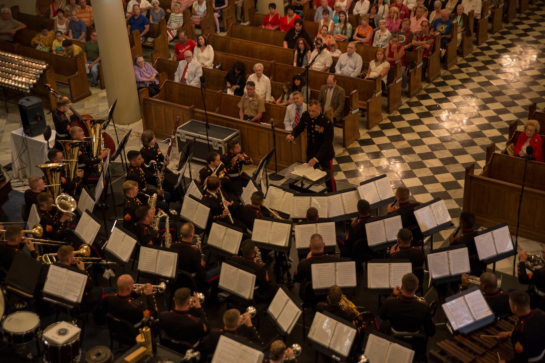 Chief Warrant Officer 2 Bryan Sherlock, the band officer for Marine Corps Band New Orleans, conducts the band during a Memorial Day concert at the St. Louis Cathedral, May 25, 2014. The performance was part of a three-concert series held to remember the fallen men and women who have served in the armed forces. The band also played at the National World War II Museum and the Northshore Harbor Center in Slidell, Louisiana during, their Memorial Day concert series.