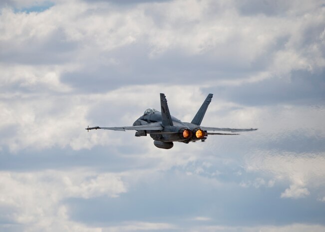 A U.S. Navy F/A-18C Hornet assigned to Strike Fighter Squadron 131, Naval Air Station Oceana, Va. takes off during Green Flag 14-07, May 21, 2014, at Nellis Air Force Base, Nev. The F/A-18C Hornet is a multirole fighter capable of carrying out both air-to-air and air-to-ground missions. It can switch roles easily and can also be adapted for photo reconnaissance and electronic countermeasure missions. (U.S. Air Force photo by Airman 1st Class Thomas Spangler)