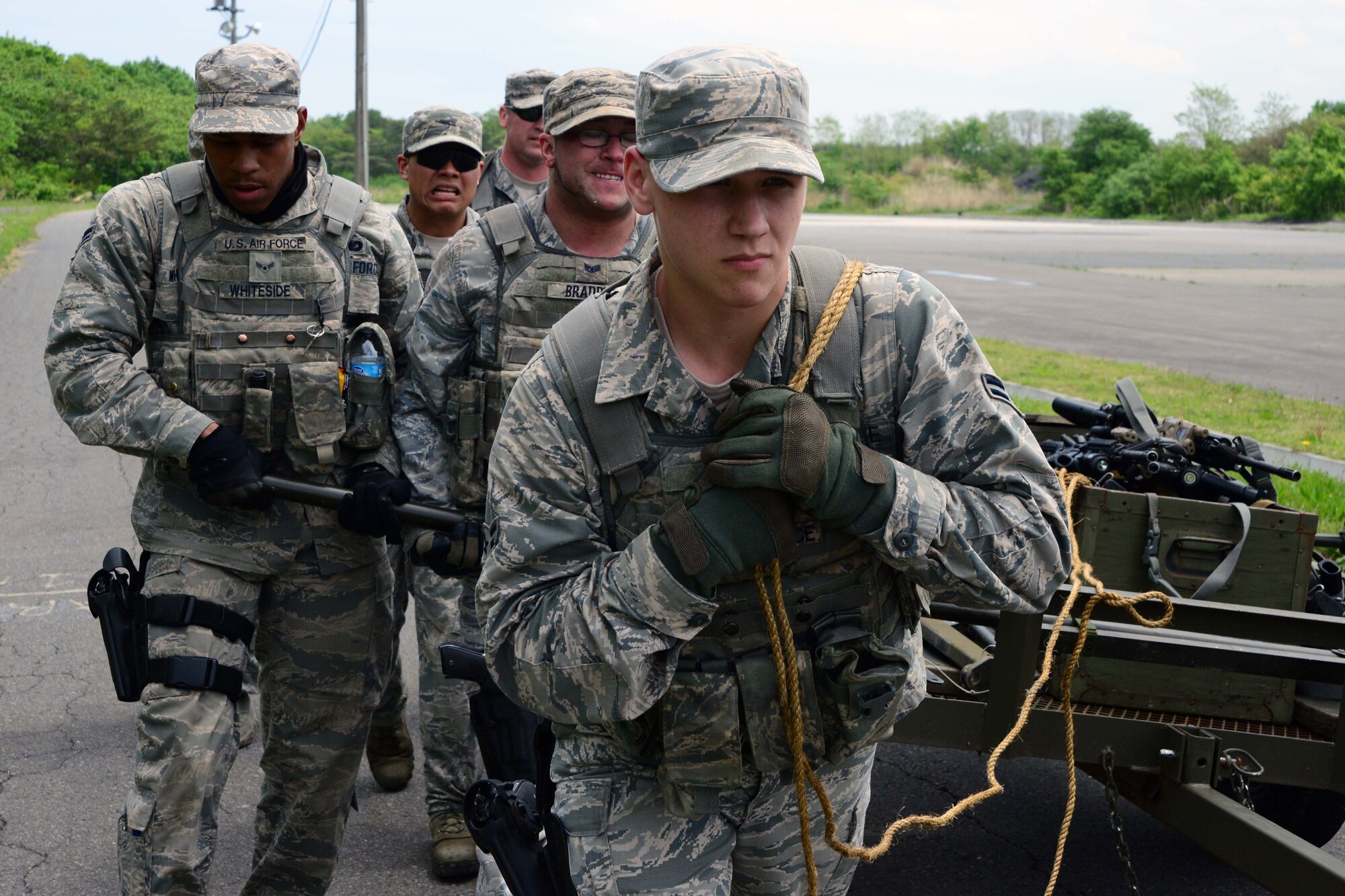 U.S. Air Force Airman 1st Class Harold Snider, front, 35th Security Forces Squadron, leads Special Reaction Team hopefuls toward their final destination during a SRT tryout day at Misawa Air Base, Japan, May 27, 2014. Eight 35 SFS members completed a day-long training session that challenged them both mentally and physical through a variety of teambuilding exercises. (U.S. Air Force photo/Senior Airman Derek VanHorn)