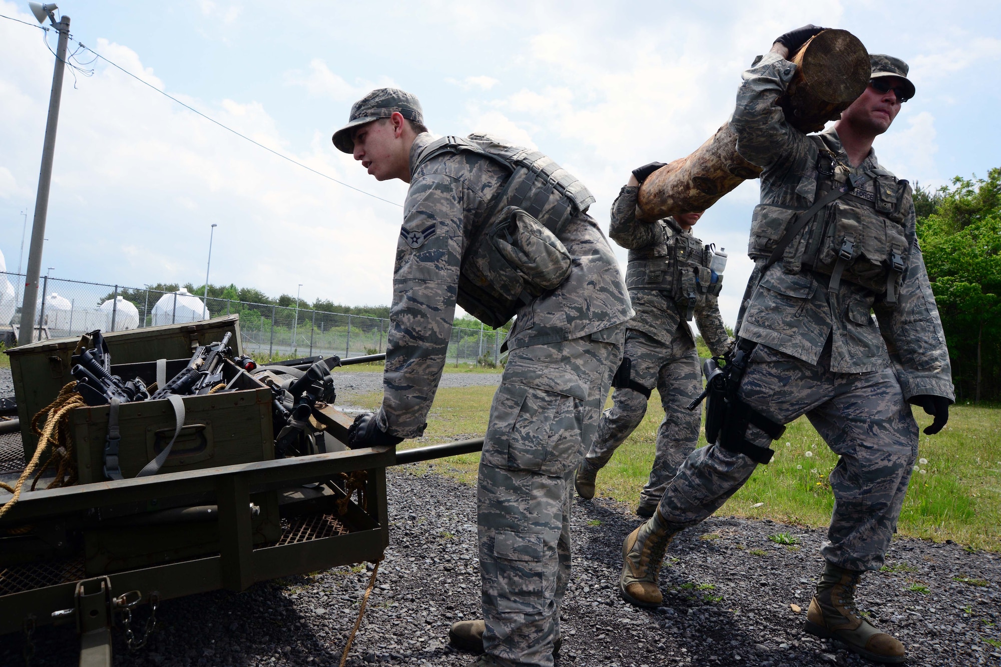 Members of the 35th Security Forces Squadron transport equipment during a Special Reaction Team training day at Misawa Air Base, Japan, May 27, 2014. Eight Airmen from the 35 SFS tried out to become members of the team, which specializes in high-risk situations and emergencies. (U.S. Air Force photo/Senior Airman Derek VanHorn)