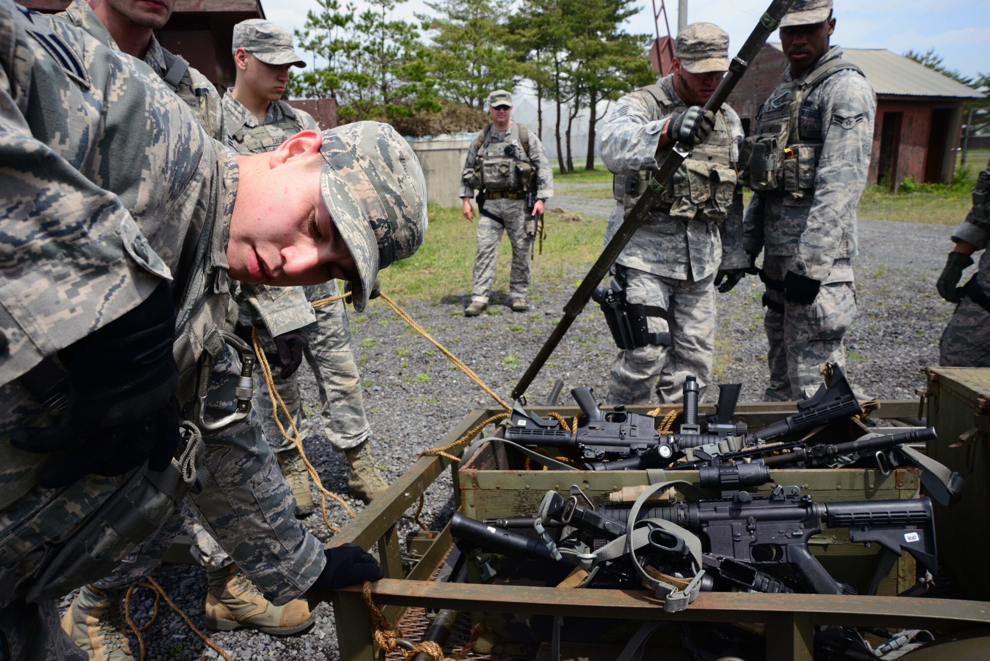 U.S. Air Force Airman 1st Class Eric Shenton, 35th Security Forces Squadron, readjusts his equipment before leading a Special Reaction Team on a ruck march at Misawa Air Base, Japan, May 27, 2014. The 35 SFS dedicated a day for defenders to try out to become a part of the 35 SFS’s SRT, which responds to high-risk situations and emergencies. (U.S. Air Force photo/Senior Airman Derek VanHorn)