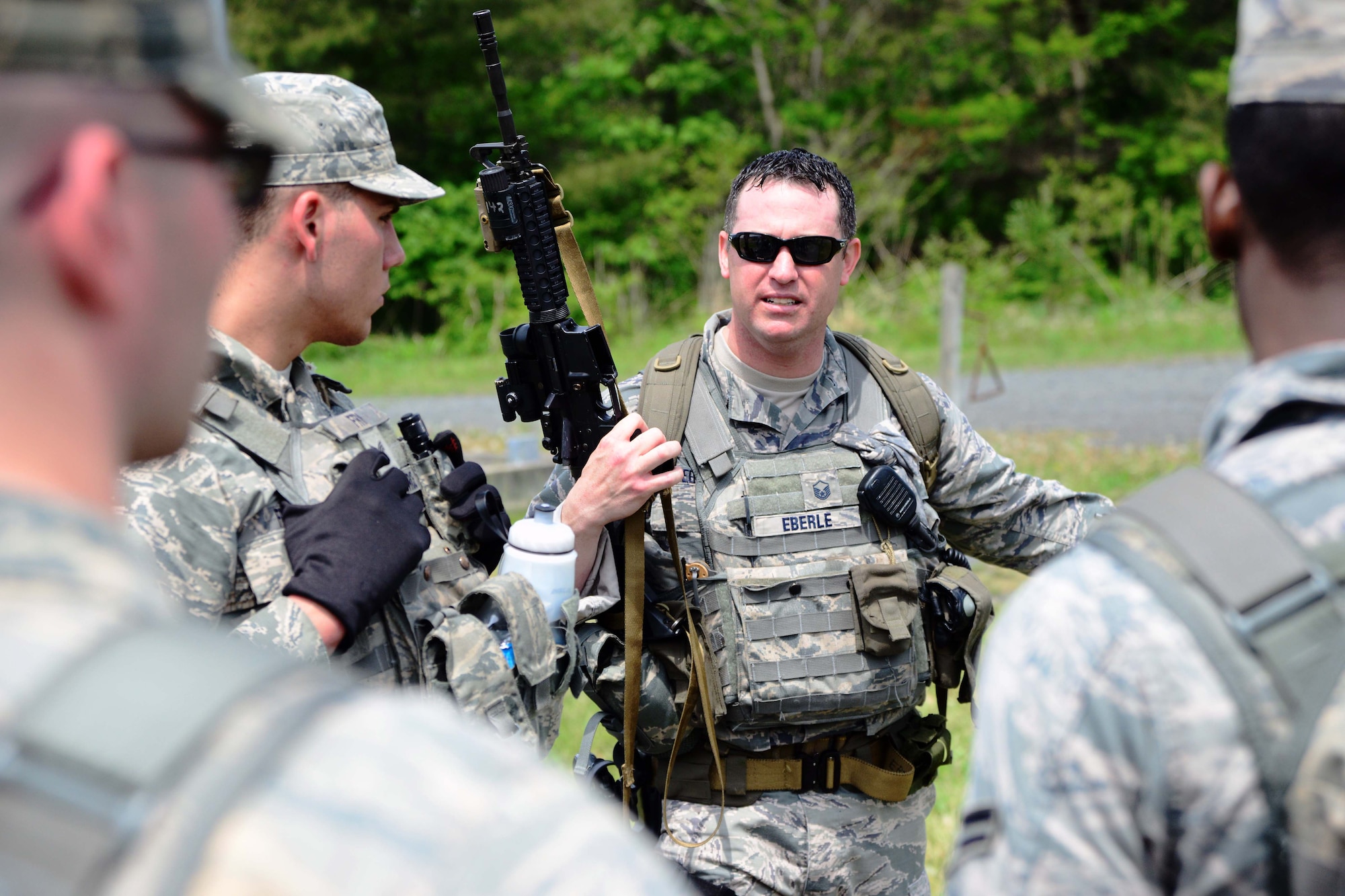 U.S. Air Force Master Sgt. Roy Eberle, 35th Security Forces Squadron, briefs Special Reaction Team hopefuls on their next task of transporting equipment on a damaged trailer at Misawa Air Base, Japan, May 27, 2014. Eight Airmen tried out to become SRT members, which is the U.S. Air Force’s version of a Special Weapons and Tactics team. (U.S. Air Force photo/Senior Airman Derek VanHorn)