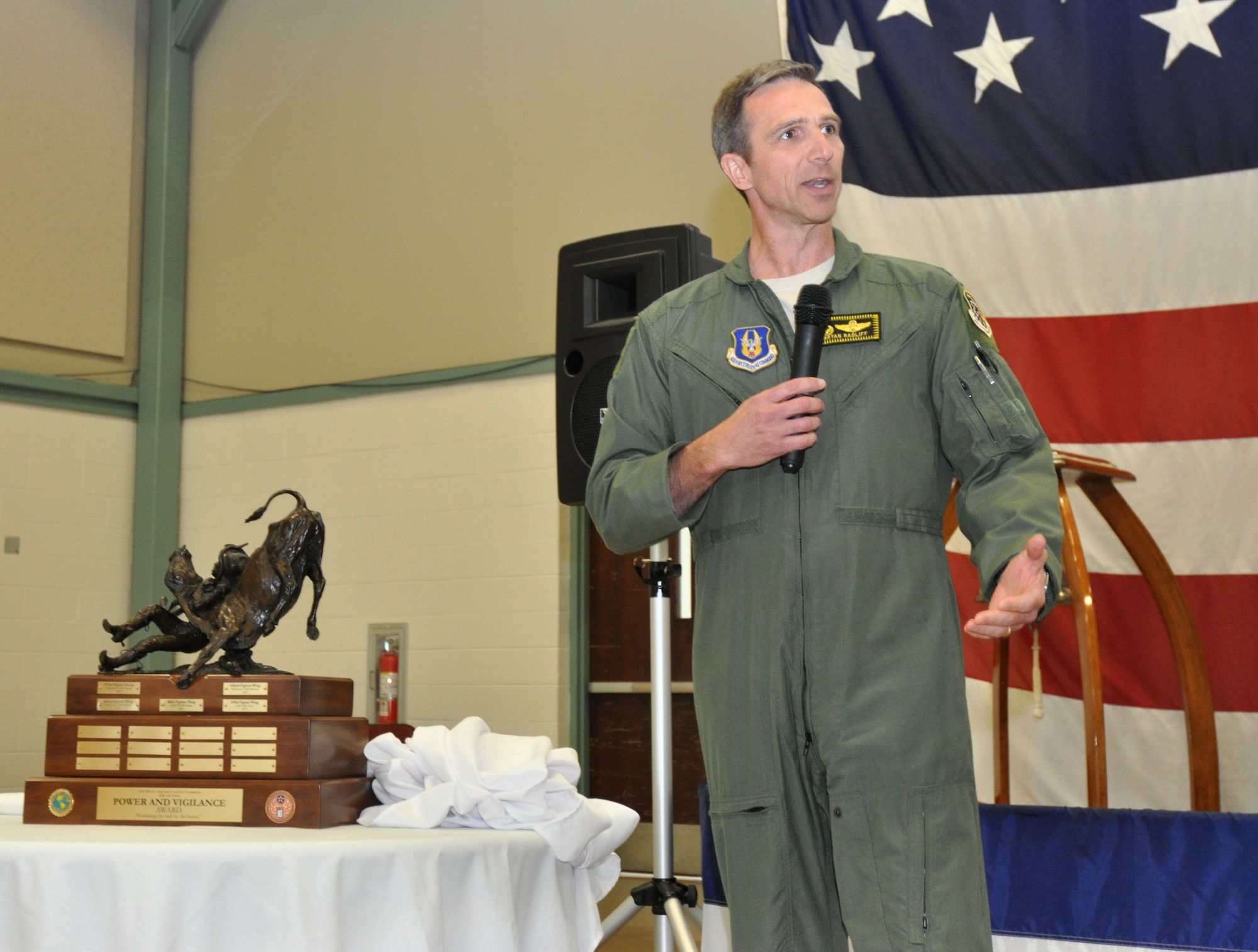 Col. Bryan Radliff, 419th Fighter Wing commander, takes a moment to express his thanks to 10th Air Force in naming the 419 FW, Hill Air Force Base, Utah, as this year’s Power and Vigilance trophy recipient.  This is only the fifth year this trophy has found a home. The first four winners being the 477th Fighter Group, Elmendorf, Alaska, 482nd Fighter Wing, Homestead ARB, Fla., 301st Fighter Wing, NAS Fort Worth JRB, Texas, and the 442nd Fighter Wing, Whiteman AFB, Missouri. The Power and Vigilance Award is presented annually to the 10 AF Reserve unit that exhibits the NAF mission as "the premier provider of affordable, integrated, flexible, and mission-ready Citizen Airmen to execute power and vigilance missions in support of U.S. National Security.” The symbolism of the bronze figure on the award says it all, ‘grabbing the bull by the horns’. (U.S. Air Force photo/Master Sgt. Julie Briden-Garcia) 