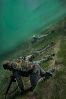 Members of the 5th Civil Engineer Squadron crawl through smoke created by a smoke bomb during an exercise at Minot Air Force Base N.D., May 21, 2014. The exercise was part of a pre-deployment training session. (U.S. Air Force photo/Airman 1st Class Lauren Pitts) ) 