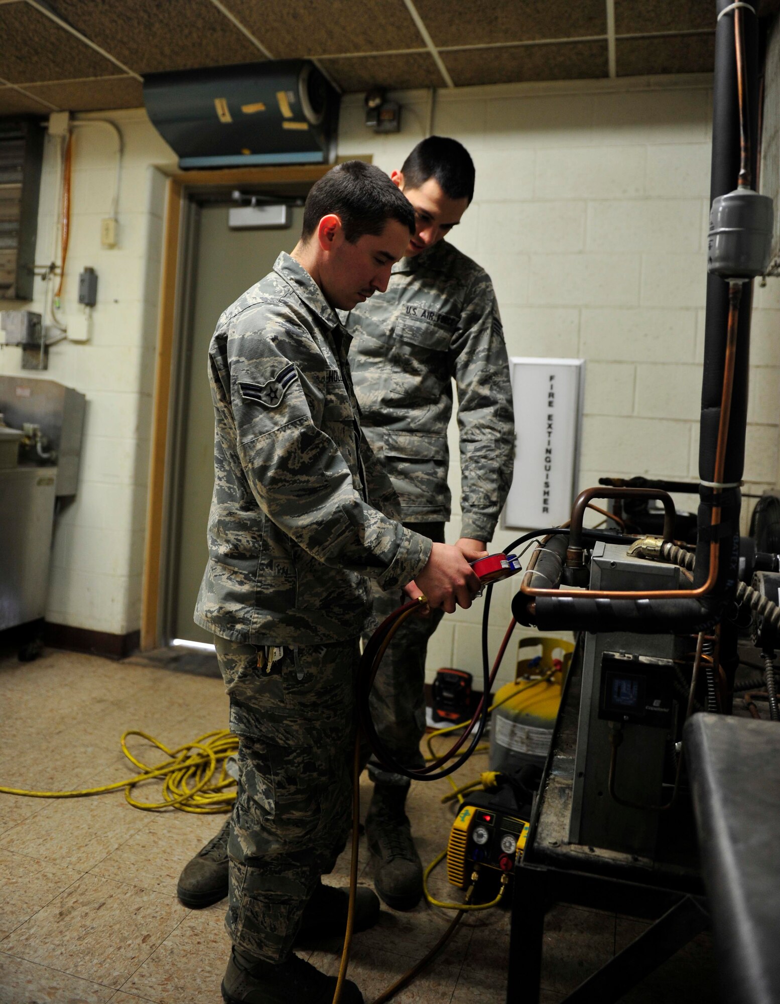 The Heating, Ventilation, Air Conditioning, and Refrigeration specialists of the 5th Civil Engineer Squadron are responsible for installing, maintaining and repairing furnaces, boilers, stoves, heat exchangers, burners, blowers, fans and radiant heaters.  Climate control plays a large role in the comfort of the Airmen at Minot Air Force Base. HVAC is also responsible for maintaining electric, electronic and pneumatic controls associated directly with the refrigeration/cooling equipment. (U.S. Air Force photos/Senior Airman Kristoffer Kaubisch)