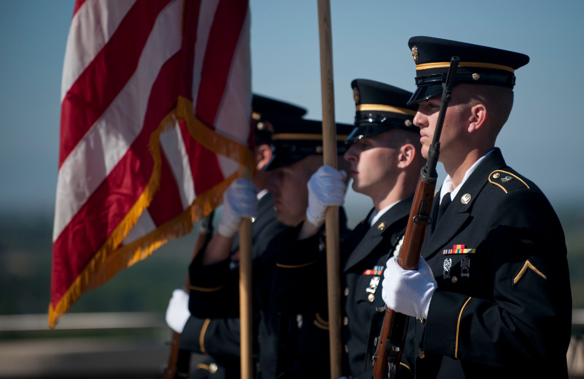 The Idaho National Guard posts the colors during the Memorial Day ceremony held at Idaho State Veterans Cemetery in Boise, Idaho, May 26, 2014. The national anthem was sung by Eagle High School students. (U.S. Air Force photo by Airman 1st Class Malissa Lott/RELEASED)